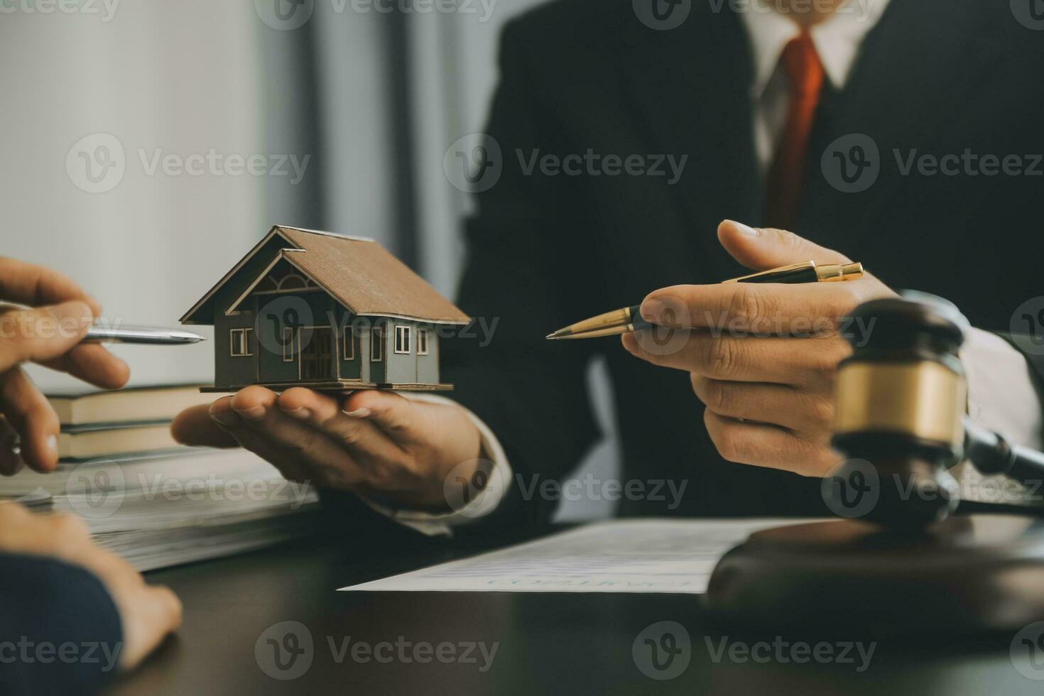 Business and lawyers discussing contract papers with brass scale on desk in office. Law, legal services, advice, justice and law concept picture with film grain effect photo