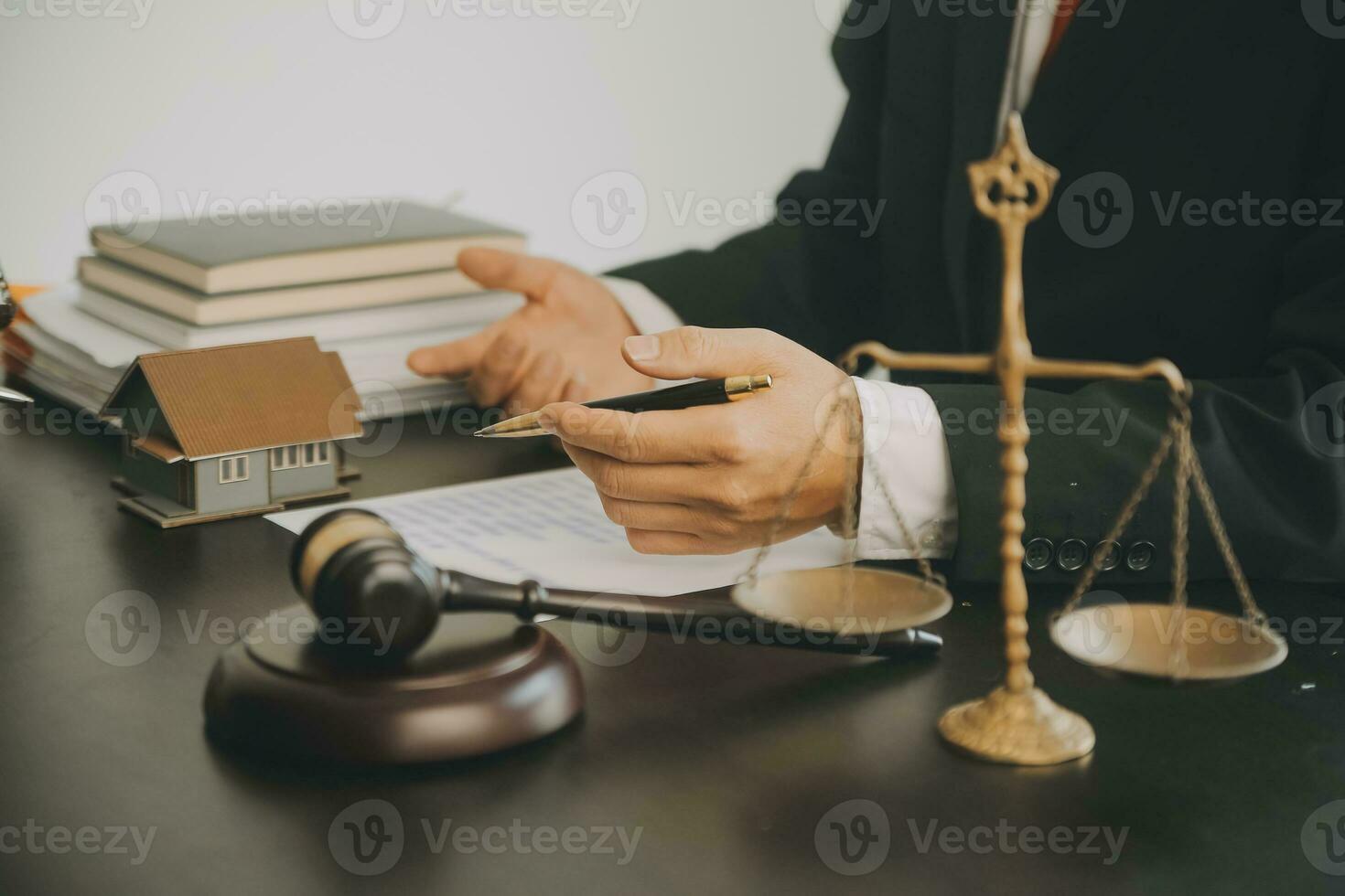 Business and lawyers discussing contract papers with brass scale on desk in office. Law, legal services, advice, justice and law concept picture with film grain effect photo