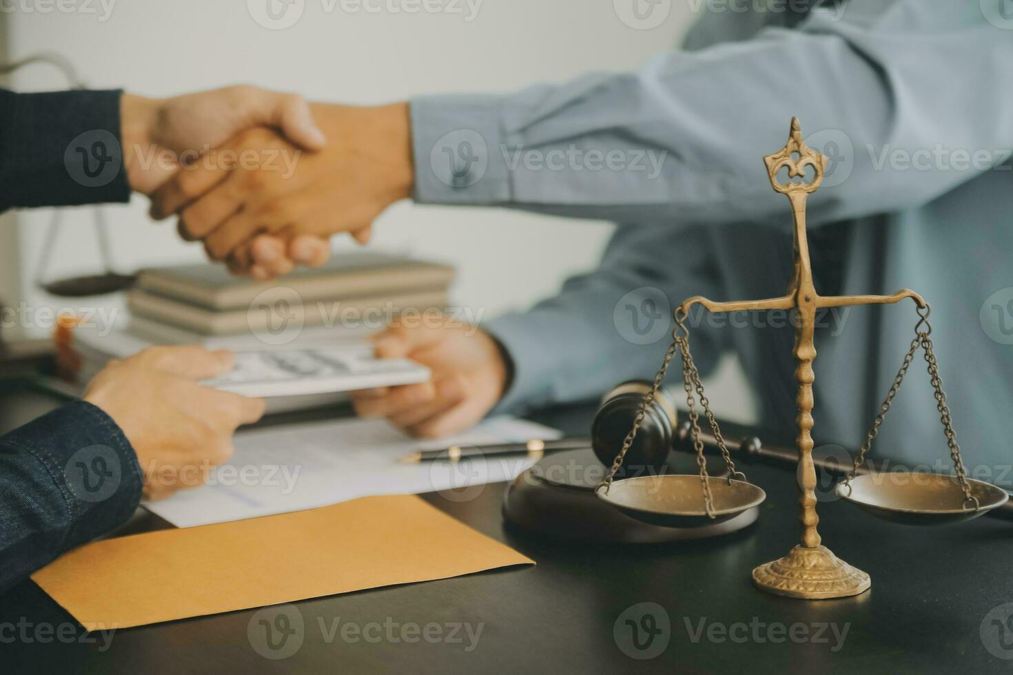 Business and lawyers discussing contract papers with brass scale on desk in office. Law, legal services, advice, justice and law concept picture with film grain effect photo