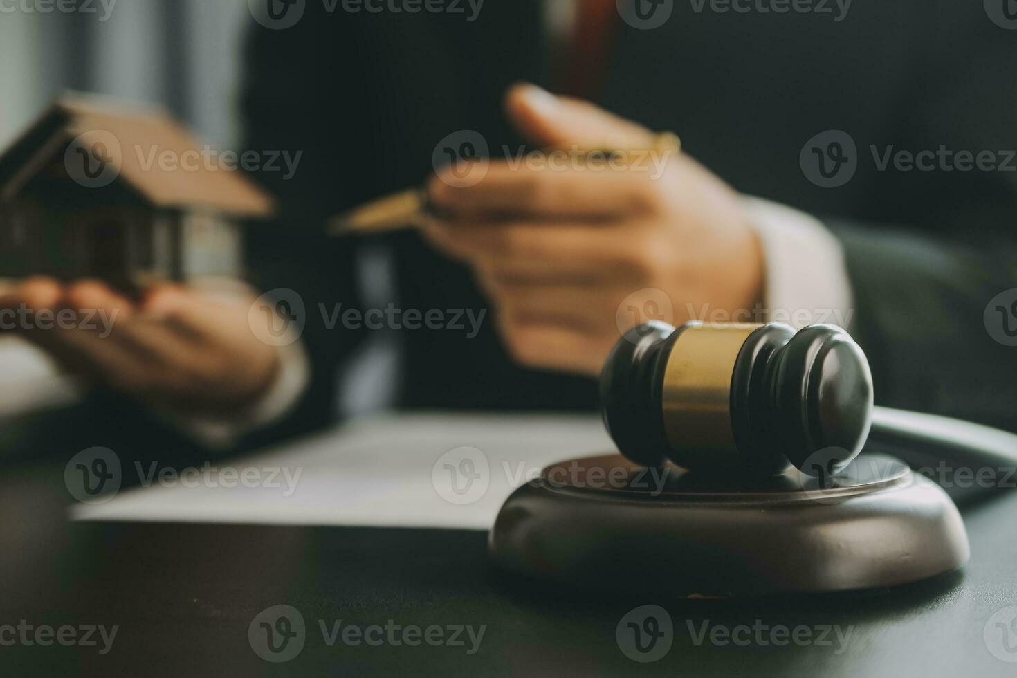 Business and lawyers discussing contract papers with brass scale on desk in office. Law, legal services, advice, justice and law concept picture with film grain effect photo