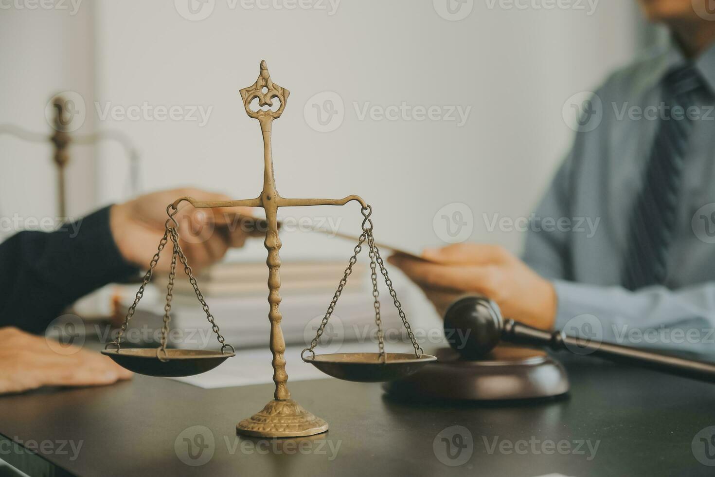 Business and lawyers discussing contract papers with brass scale on desk in office. Law, legal services, advice, justice and law concept picture with film grain effect photo