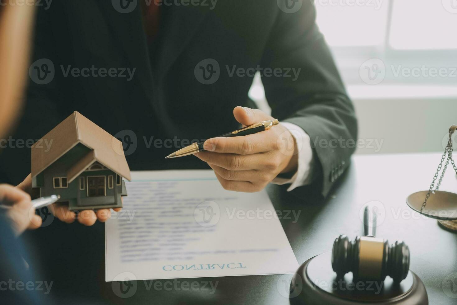 Business and lawyers discussing contract papers with brass scale on desk in office. Law, legal services, advice, justice and law concept picture with film grain effect photo
