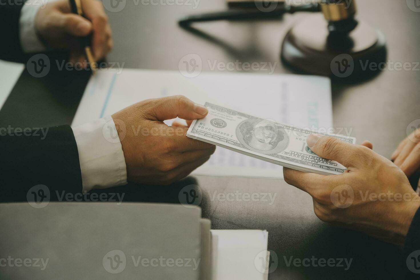 Business and lawyers discussing contract papers with brass scale on desk in office. Law, legal services, advice, justice and law concept picture with film grain effect photo