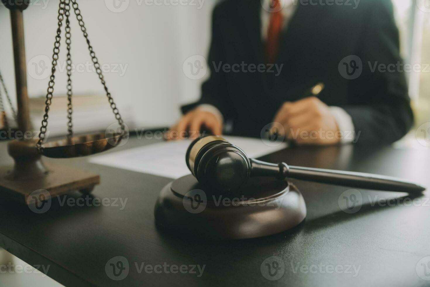 Business and lawyers discussing contract papers with brass scale on desk in office. Law, legal services, advice, justice and law concept picture with film grain effect photo