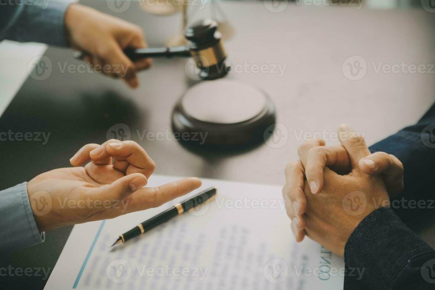 Business and lawyers discussing contract papers with brass scale on desk in office. Law, legal services, advice, justice and law concept picture with film grain effect photo