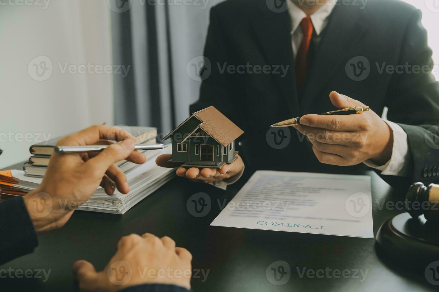 Business and lawyers discussing contract papers with brass scale on desk in office. Law, legal services, advice, justice and law concept picture with film grain effect photo