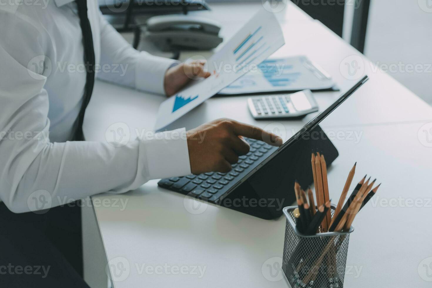Close up of Business team analyzing income charts and graphs with modern laptop computer. Business analysis and strategy concept. photo