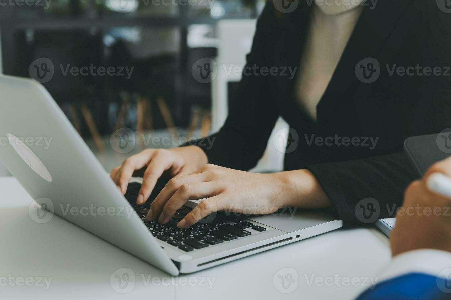 Close up of Business team analyzing income charts and graphs with modern laptop computer. Business analysis and strategy concept. photo