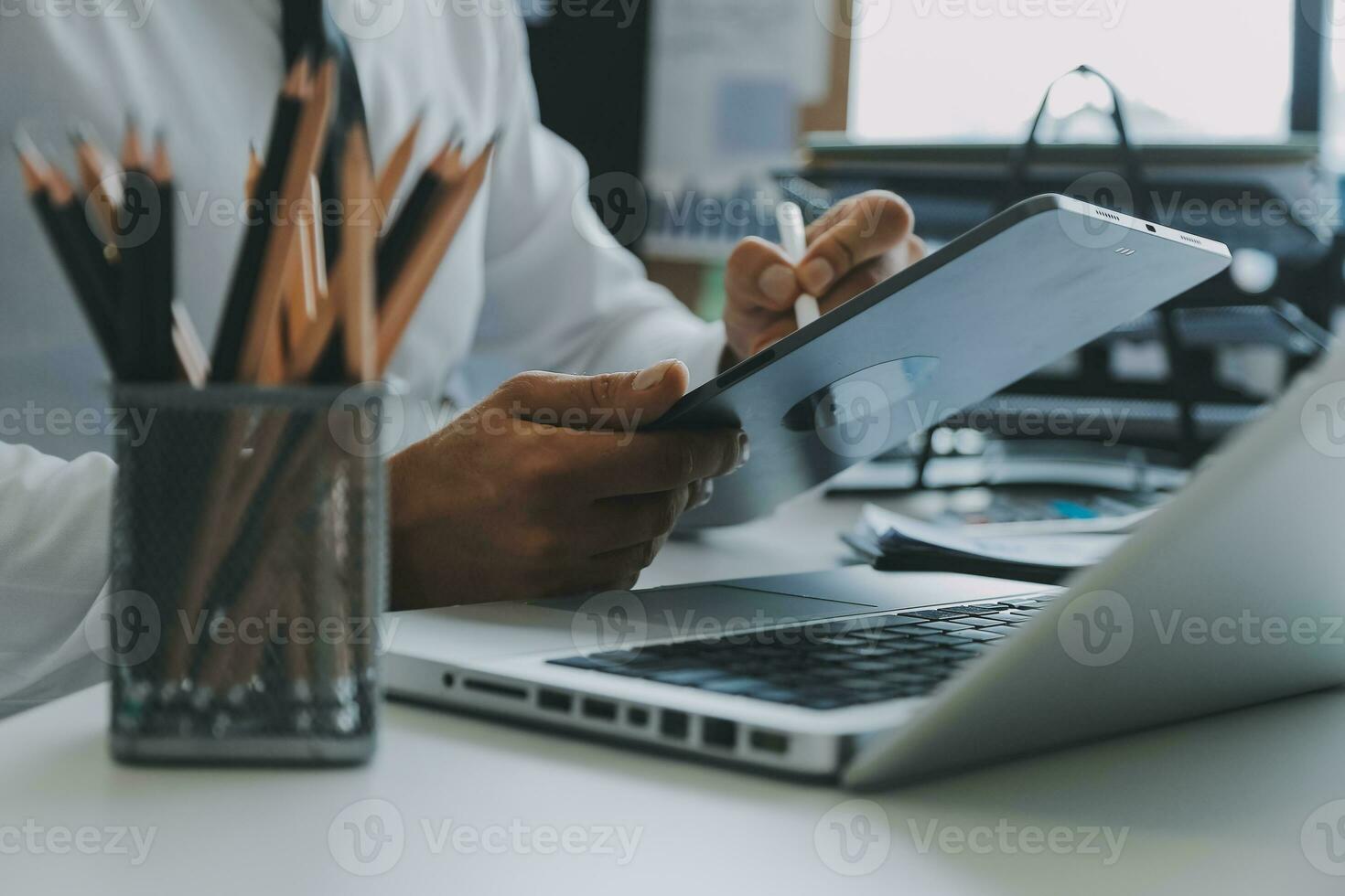 Close up of Business team analyzing income charts and graphs with modern laptop computer. Business analysis and strategy concept. photo