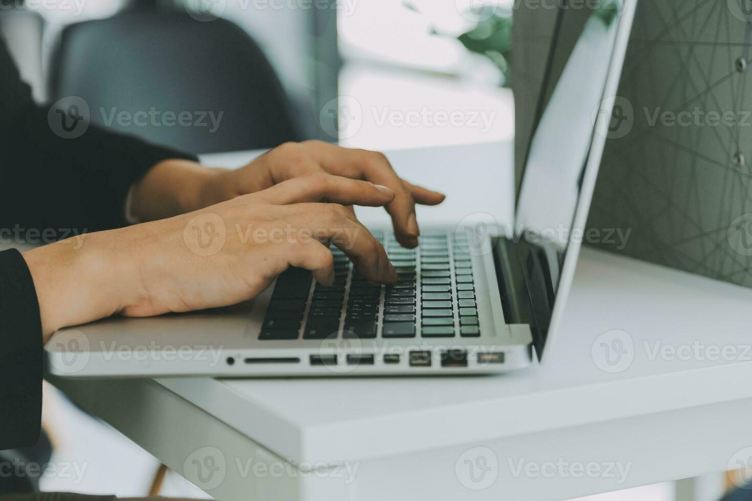 Close up of Business team analyzing income charts and graphs with modern laptop computer. Business analysis and strategy concept. photo
