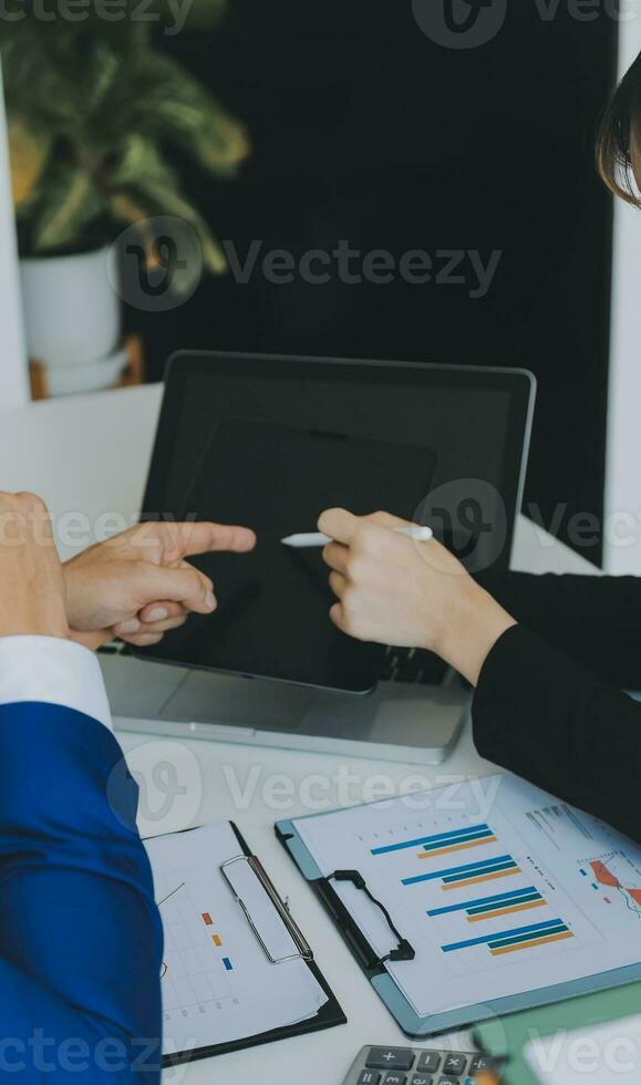 Close up of Business team analyzing income charts and graphs with modern laptop computer. Business analysis and strategy concept. photo