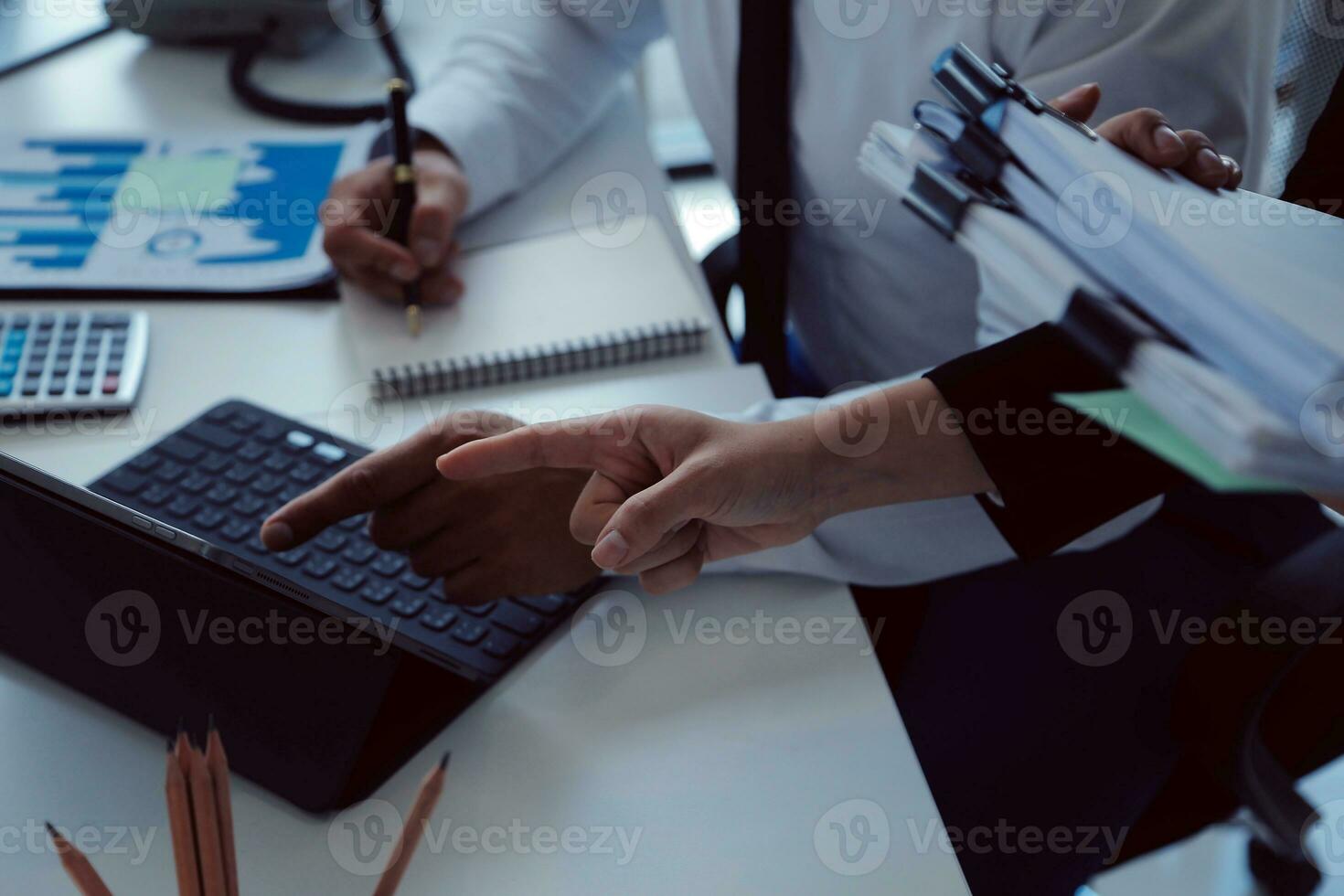 Close up of Business team analyzing income charts and graphs with modern laptop computer. Business analysis and strategy concept. photo