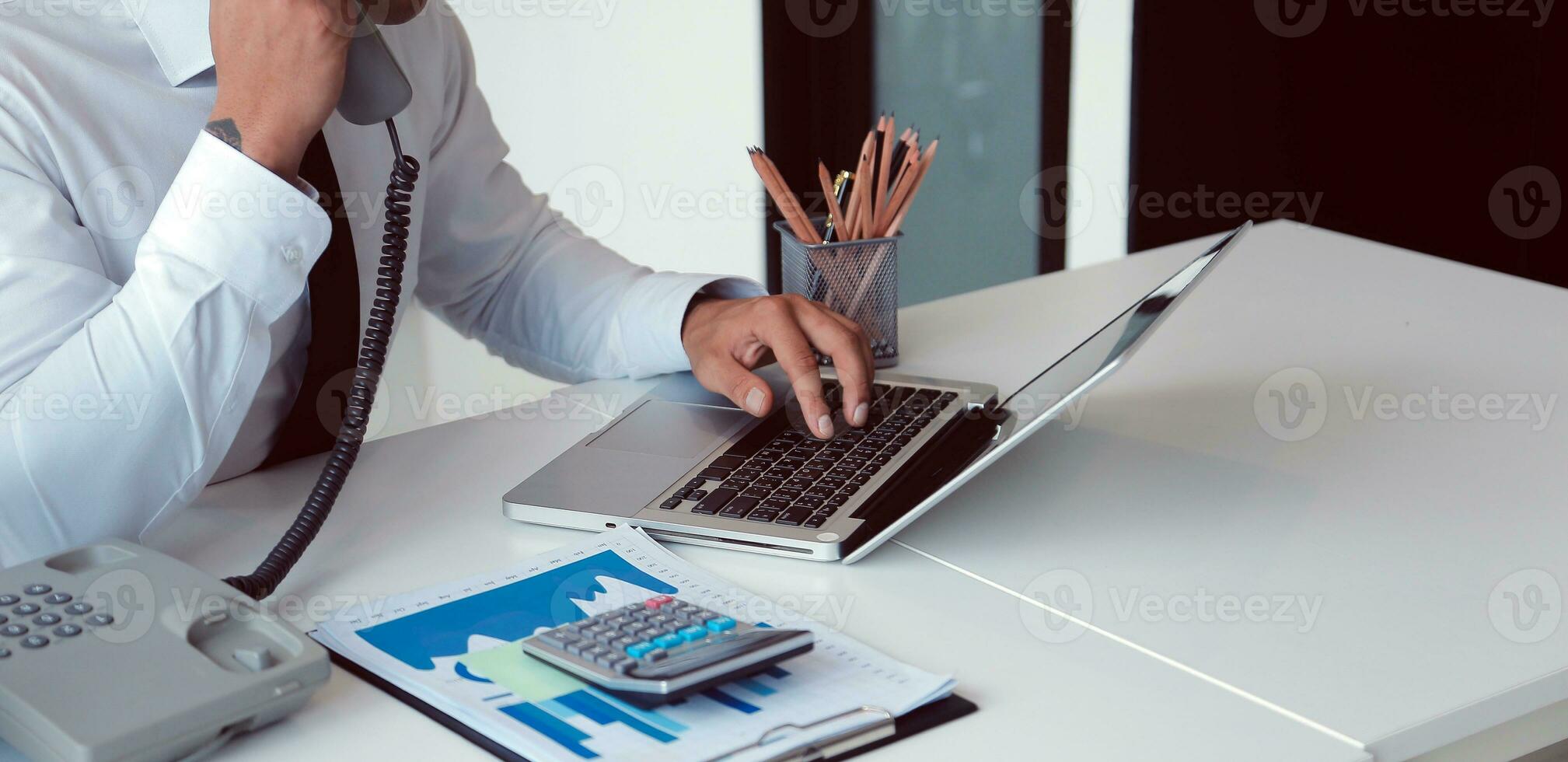 Close up of Business team analyzing income charts and graphs with modern laptop computer. Business analysis and strategy concept. photo