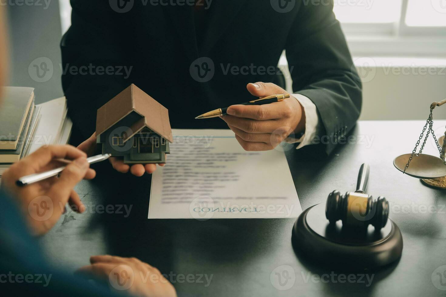Lawyer, legal advisor, businessman brainstorming information on agreement details Business contracts in legal processing books for accuracy in contract documents. joint financial investment. photo