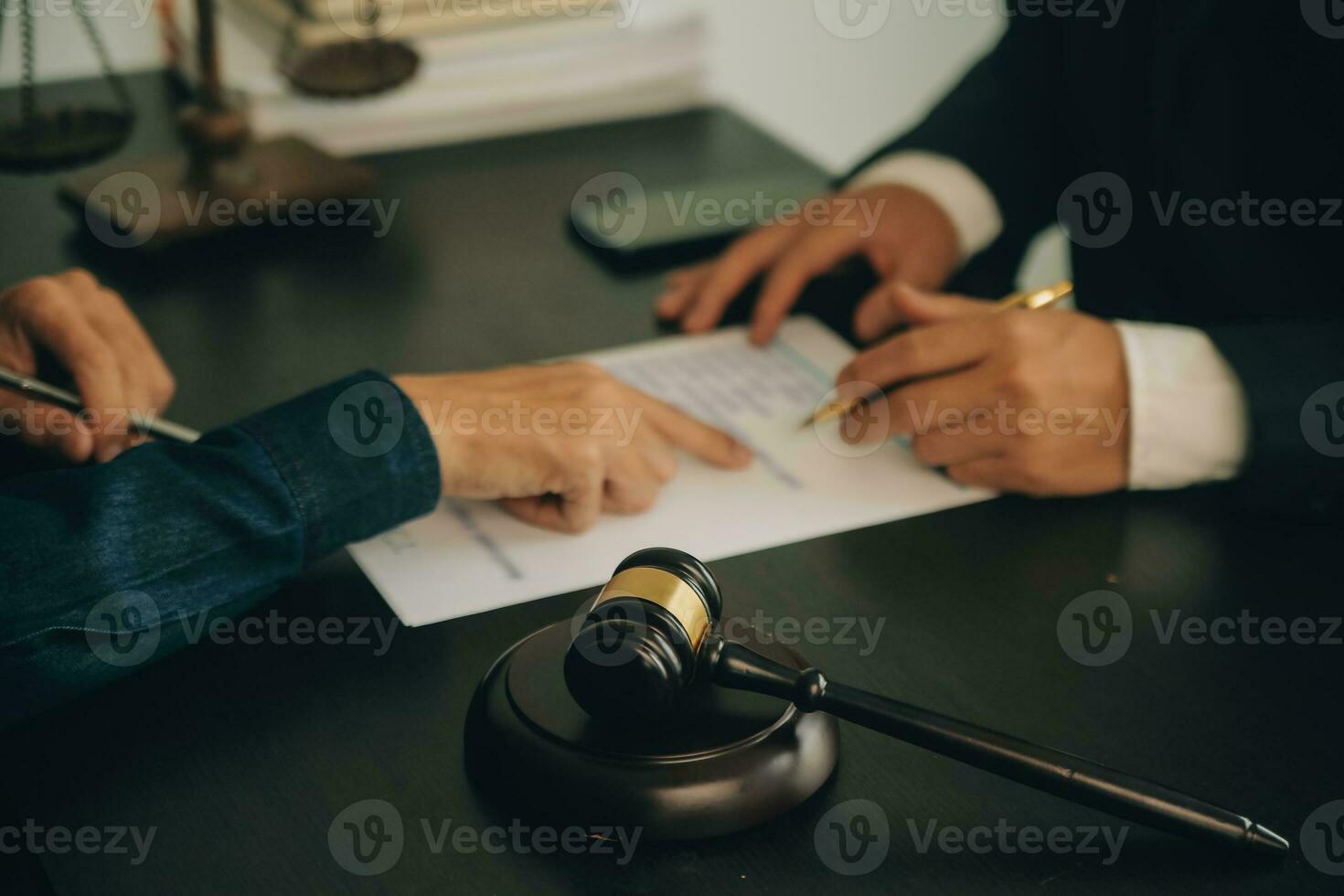 Lawyer, legal advisor, businessman brainstorming information on agreement details Business contracts in legal processing books for accuracy in contract documents. joint financial investment. photo