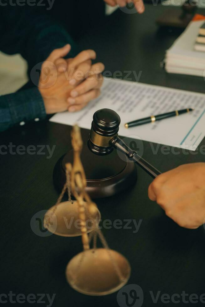 Lawyer, legal advisor, businessman brainstorming information on agreement details Business contracts in legal processing books for accuracy in contract documents. joint financial investment. photo