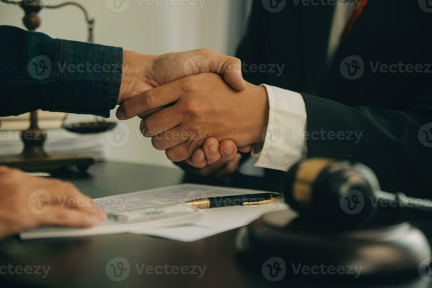 Lawyer, legal advisor, businessman brainstorming information on agreement details Business contracts in legal processing books for accuracy in contract documents. joint financial investment. photo