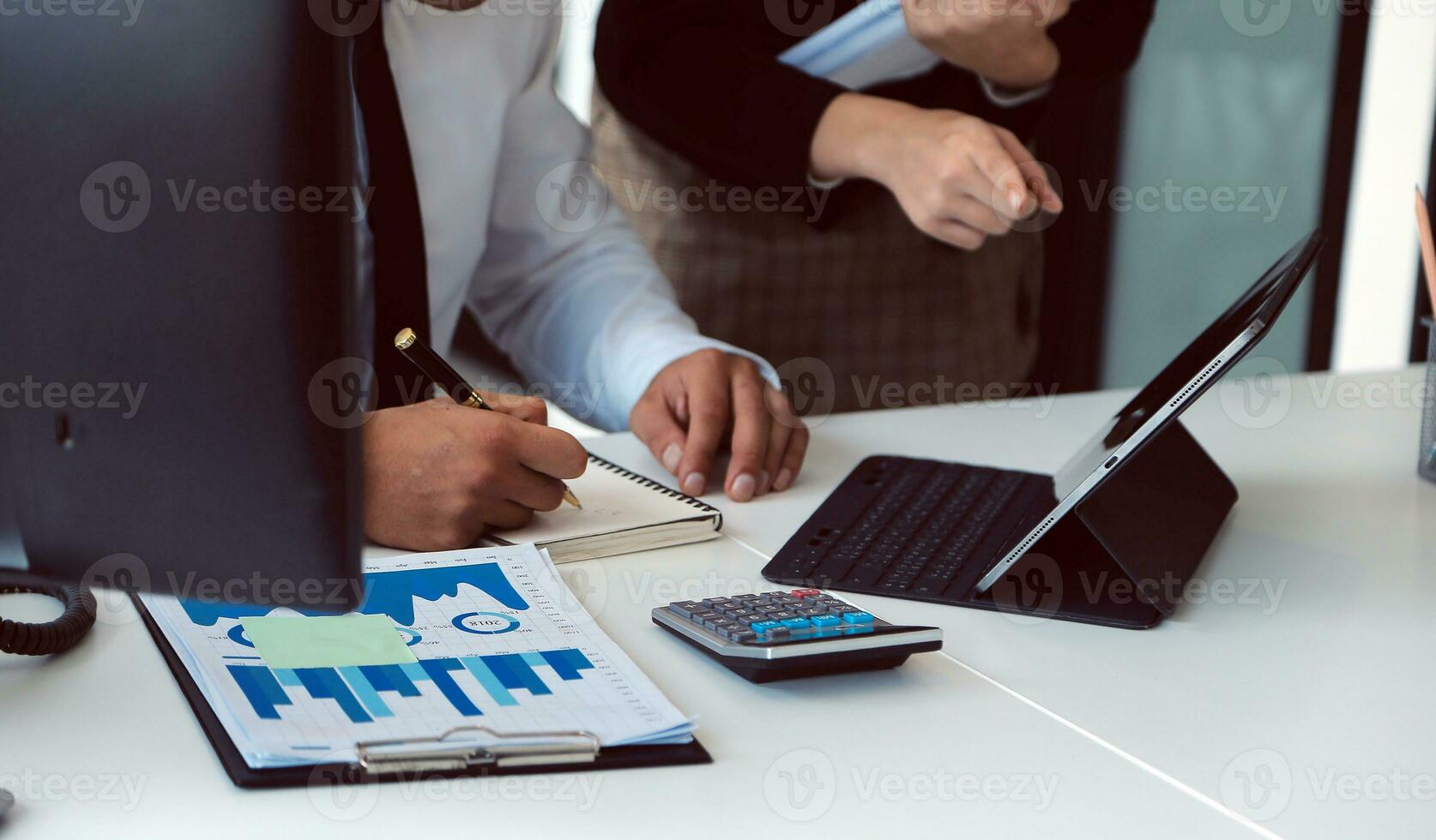 Close up of Business team analyzing income charts and graphs with modern laptop computer. Business analysis and strategy concept. photo