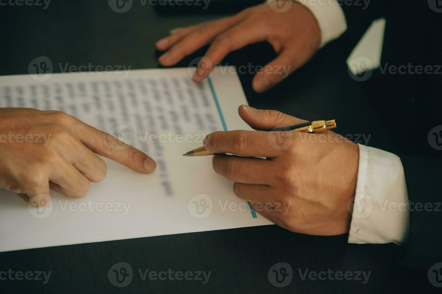 Lawyer, legal advisor, businessman brainstorming information on agreement details Business contracts in legal processing books for accuracy in contract documents. joint financial investment. photo