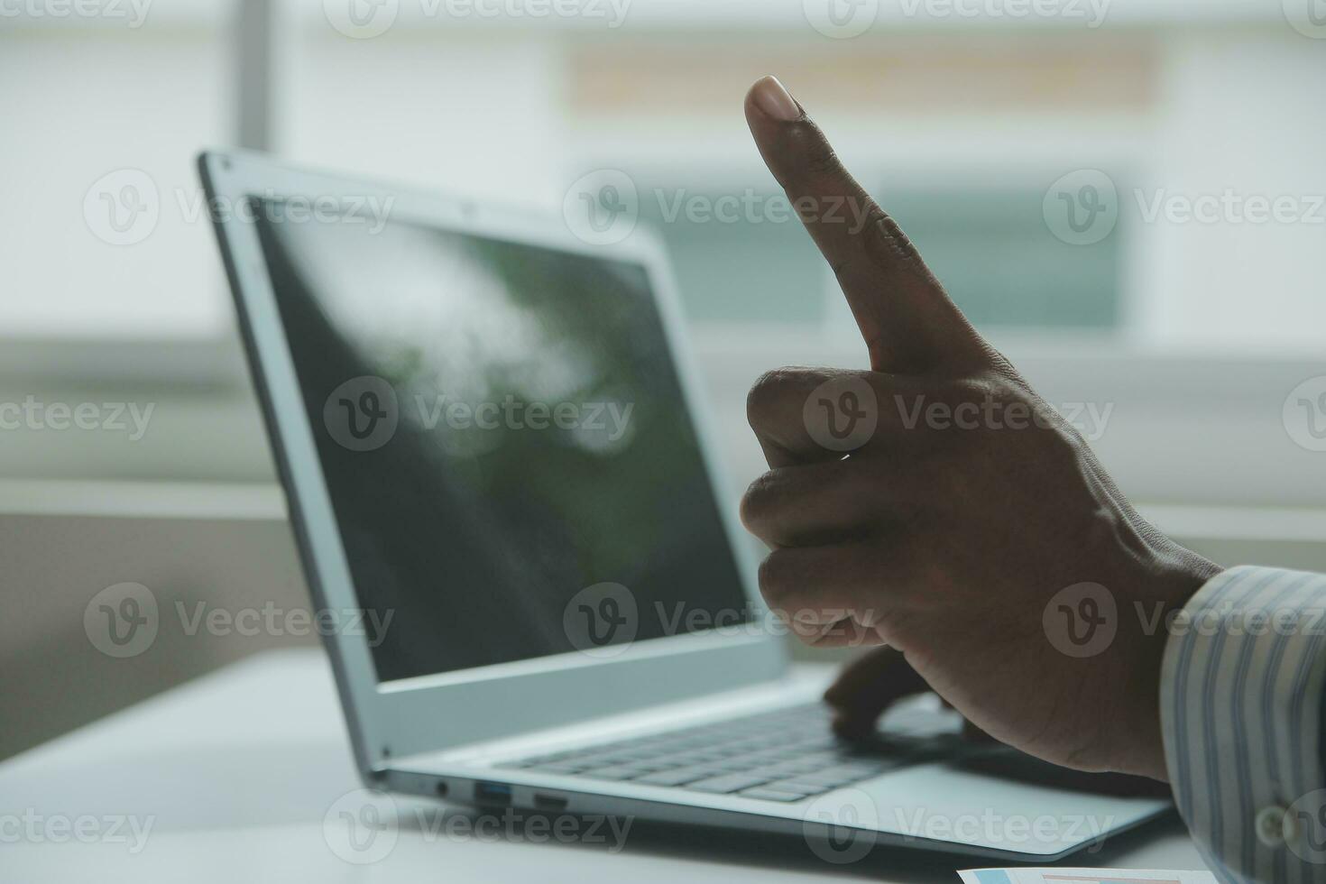 Close up Business woman using calculator and laptop for do math finance on wooden desk, tax, accounting, statistics and analytical research concept photo