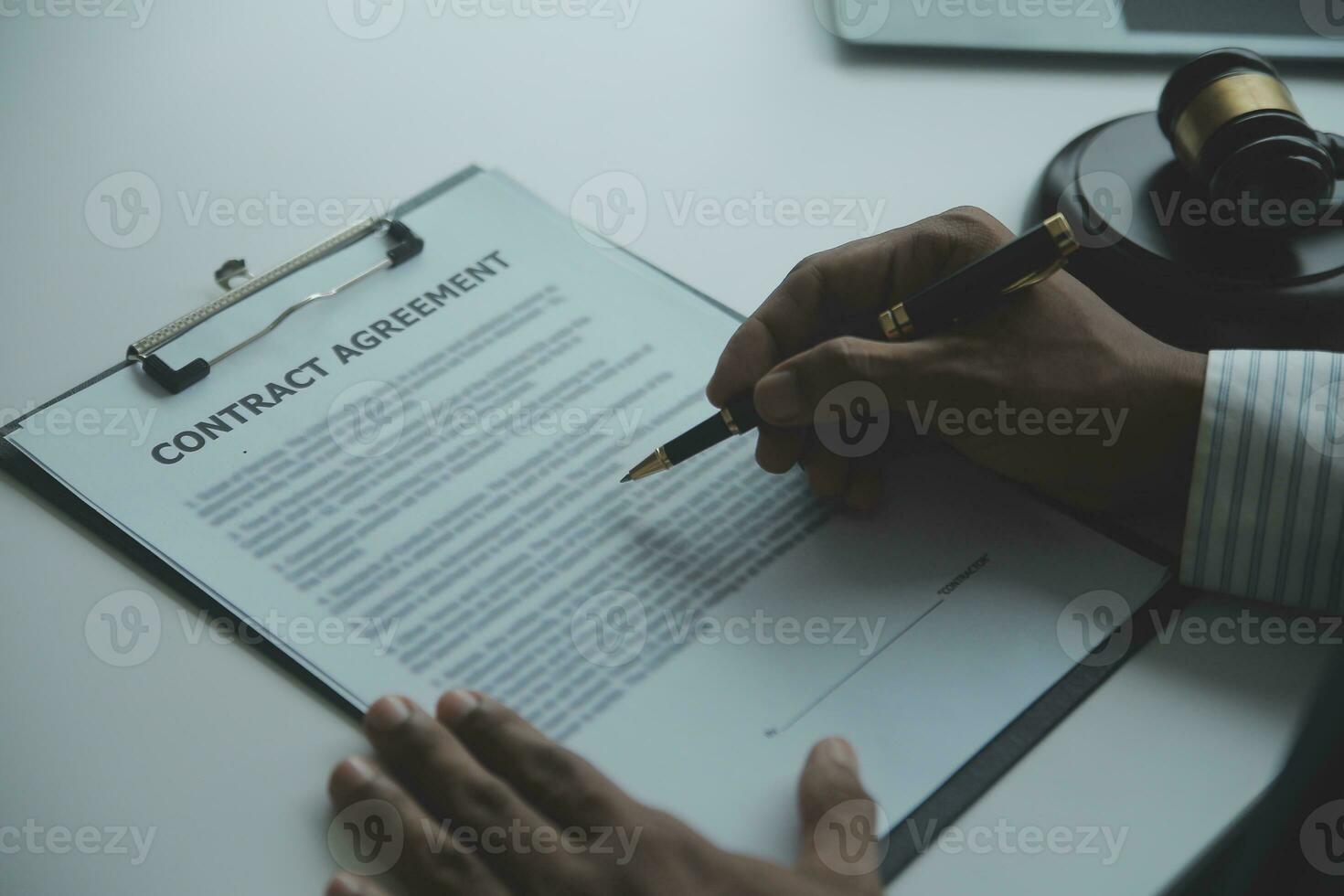 Business and lawyers discussing contract papers with brass scale on desk in office. Law, legal services, advice, justice and law concept picture with film grain effect photo