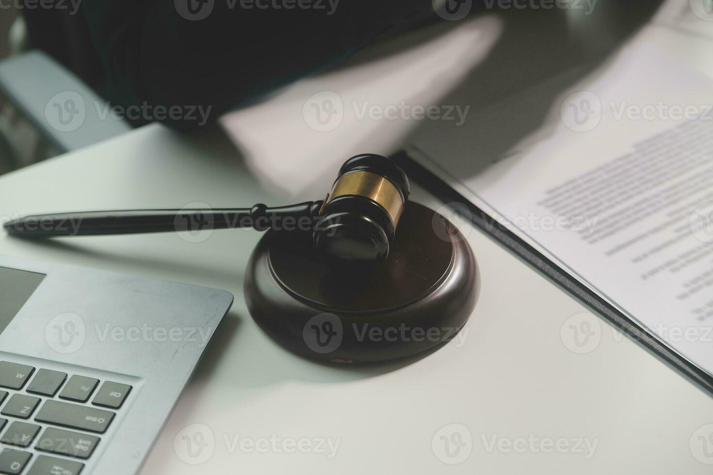 Business and lawyers discussing contract papers with brass scale on desk in office. Law, legal services, advice, justice and law concept picture with film grain effect photo