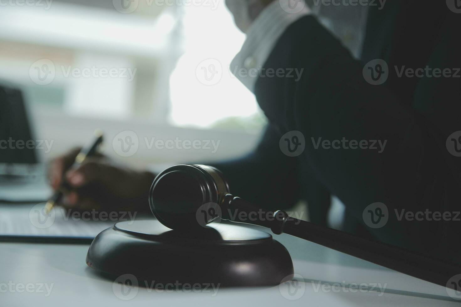Business and lawyers discussing contract papers with brass scale on desk in office. Law, legal services, advice, justice and law concept picture with film grain effect photo