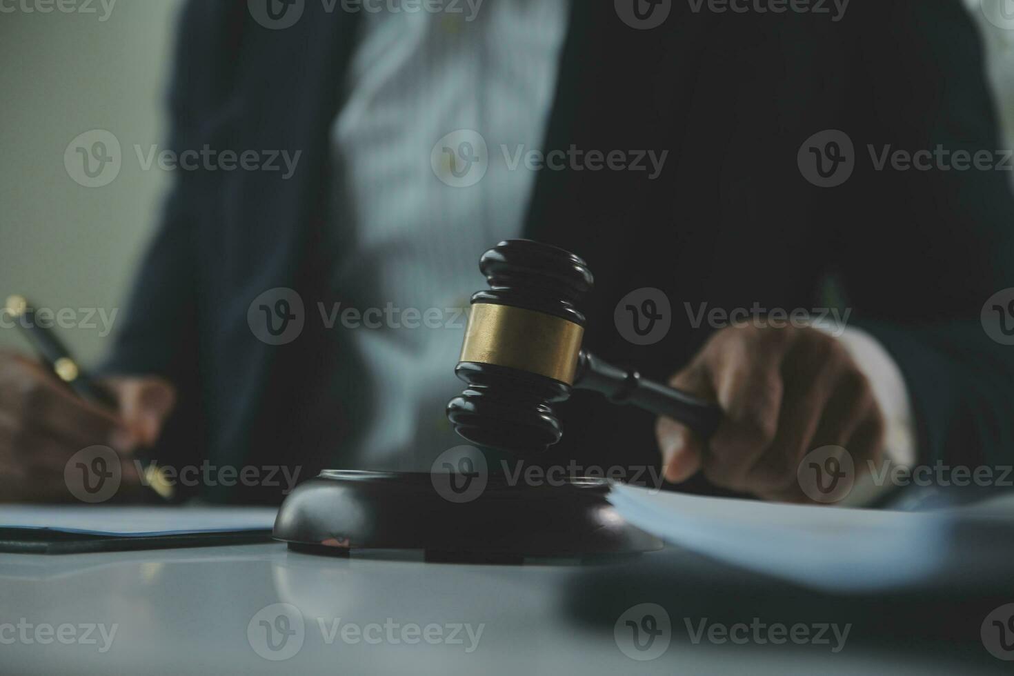 Business and lawyers discussing contract papers with brass scale on desk in office. Law, legal services, advice, justice and law concept picture with film grain effect photo