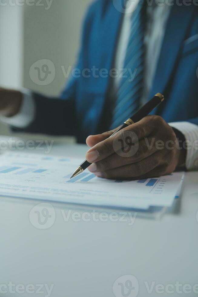 Close up Business woman using calculator and laptop for do math finance on wooden desk, tax, accounting, statistics and analytical research concept photo