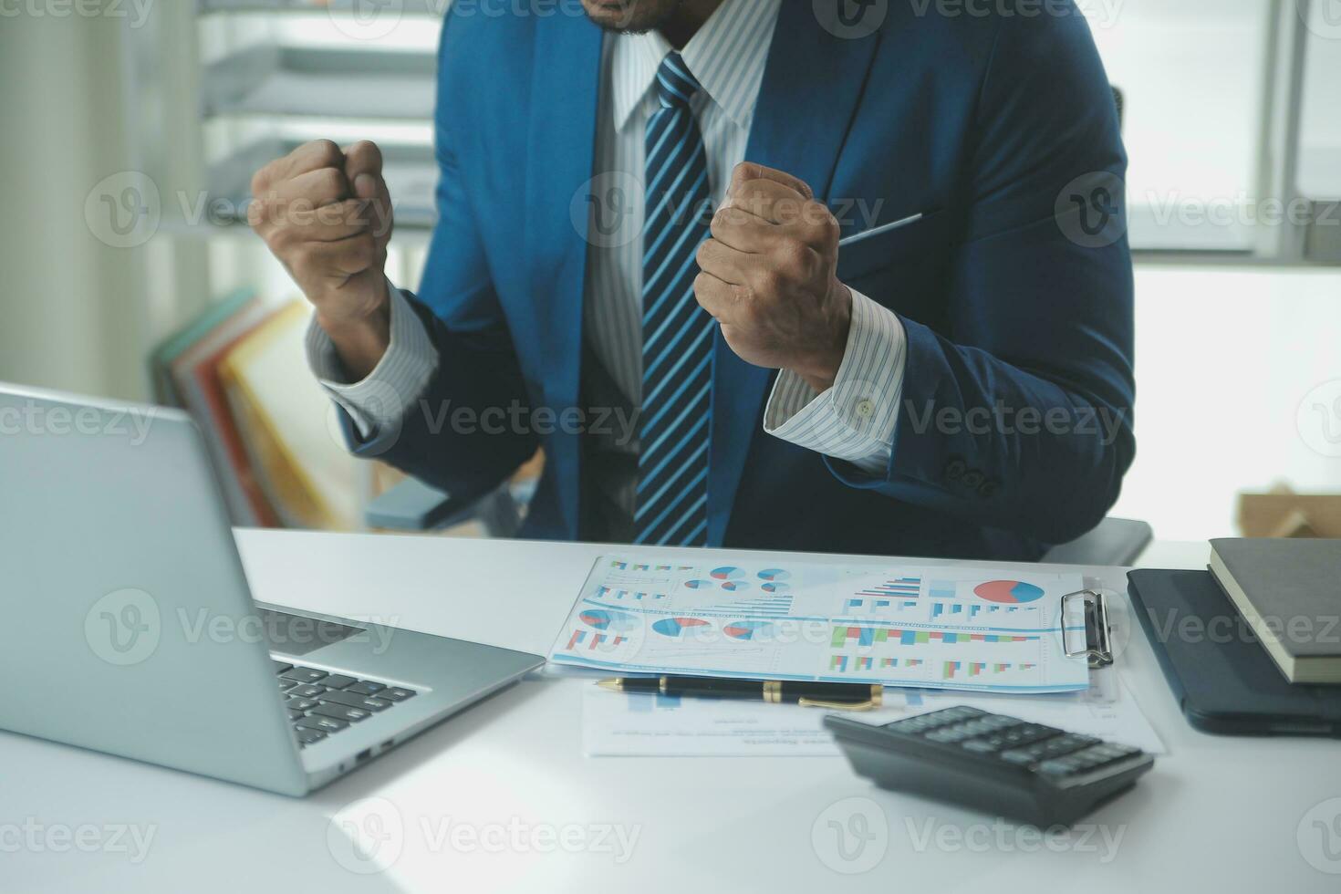 Close up Business woman using calculator and laptop for do math finance on wooden desk, tax, accounting, statistics and analytical research concept photo