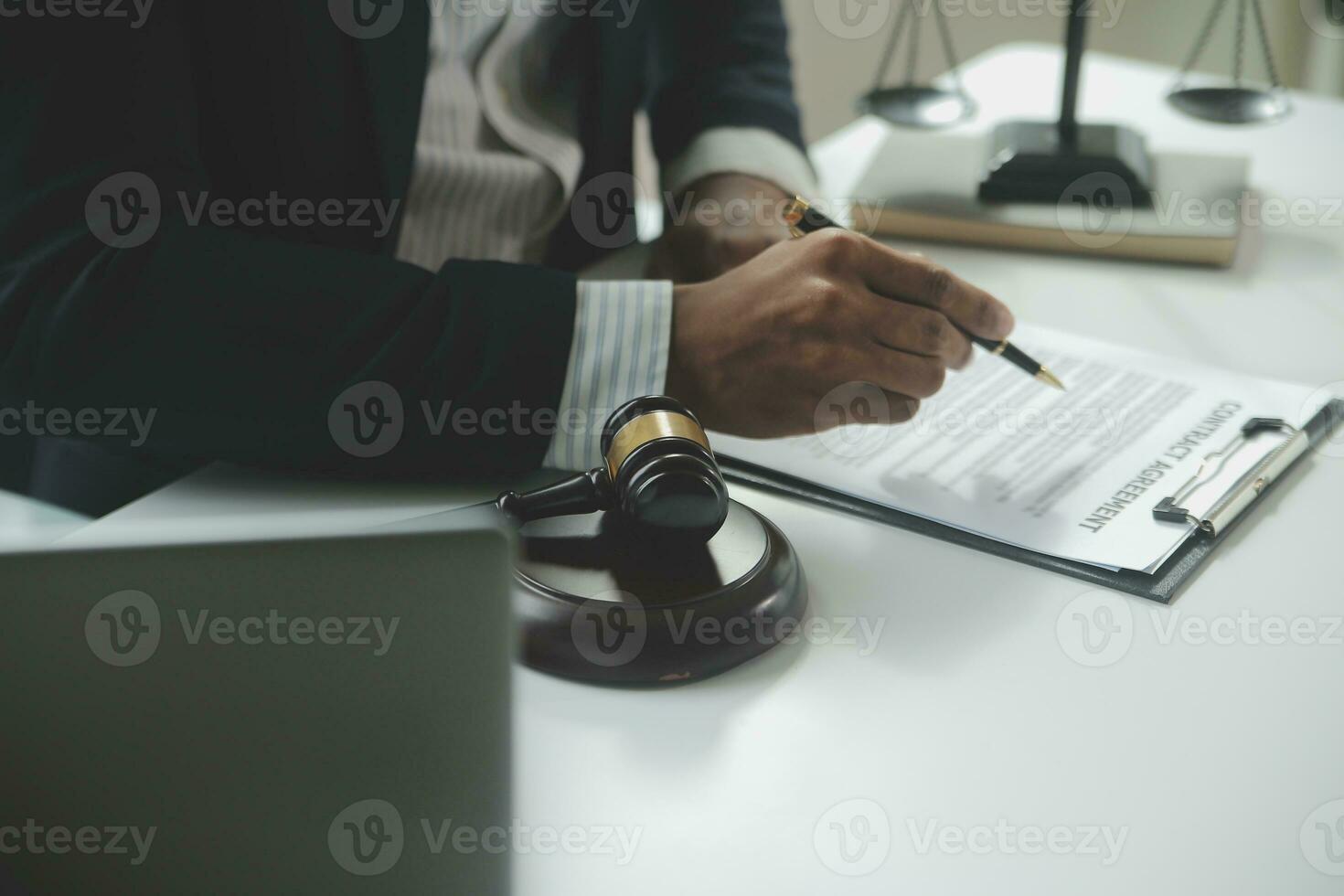Business and lawyers discussing contract papers with brass scale on desk in office. Law, legal services, advice, justice and law concept picture with film grain effect photo