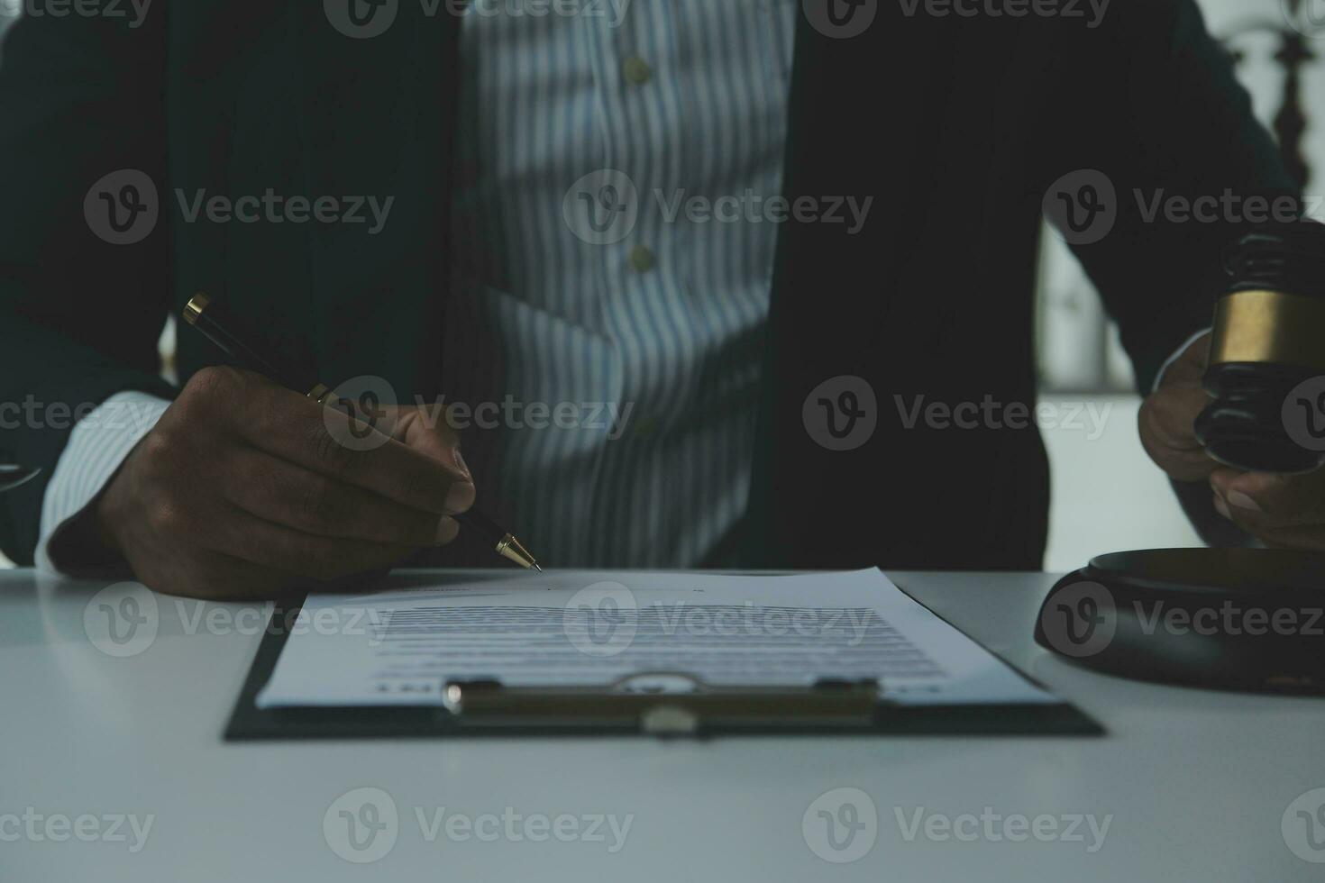 Business and lawyers discussing contract papers with brass scale on desk in office. Law, legal services, advice, justice and law concept picture with film grain effect photo