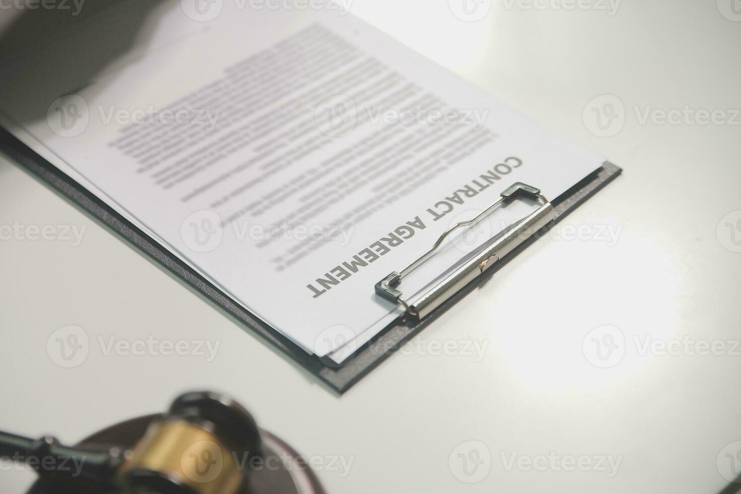Business and lawyers discussing contract papers with brass scale on desk in office. Law, legal services, advice, justice and law concept picture with film grain effect photo
