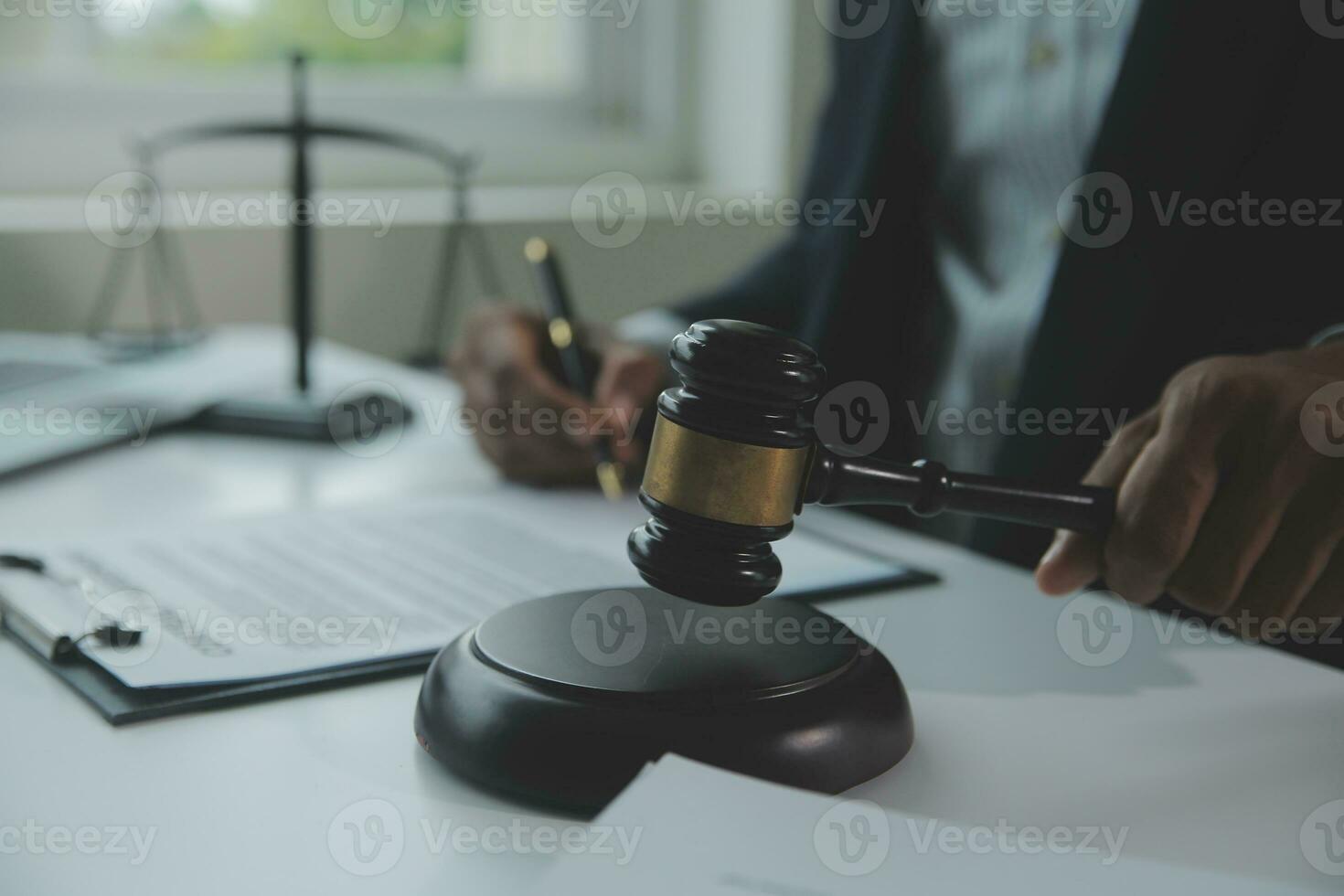 Business and lawyers discussing contract papers with brass scale on desk in office. Law, legal services, advice, justice and law concept picture with film grain effect photo