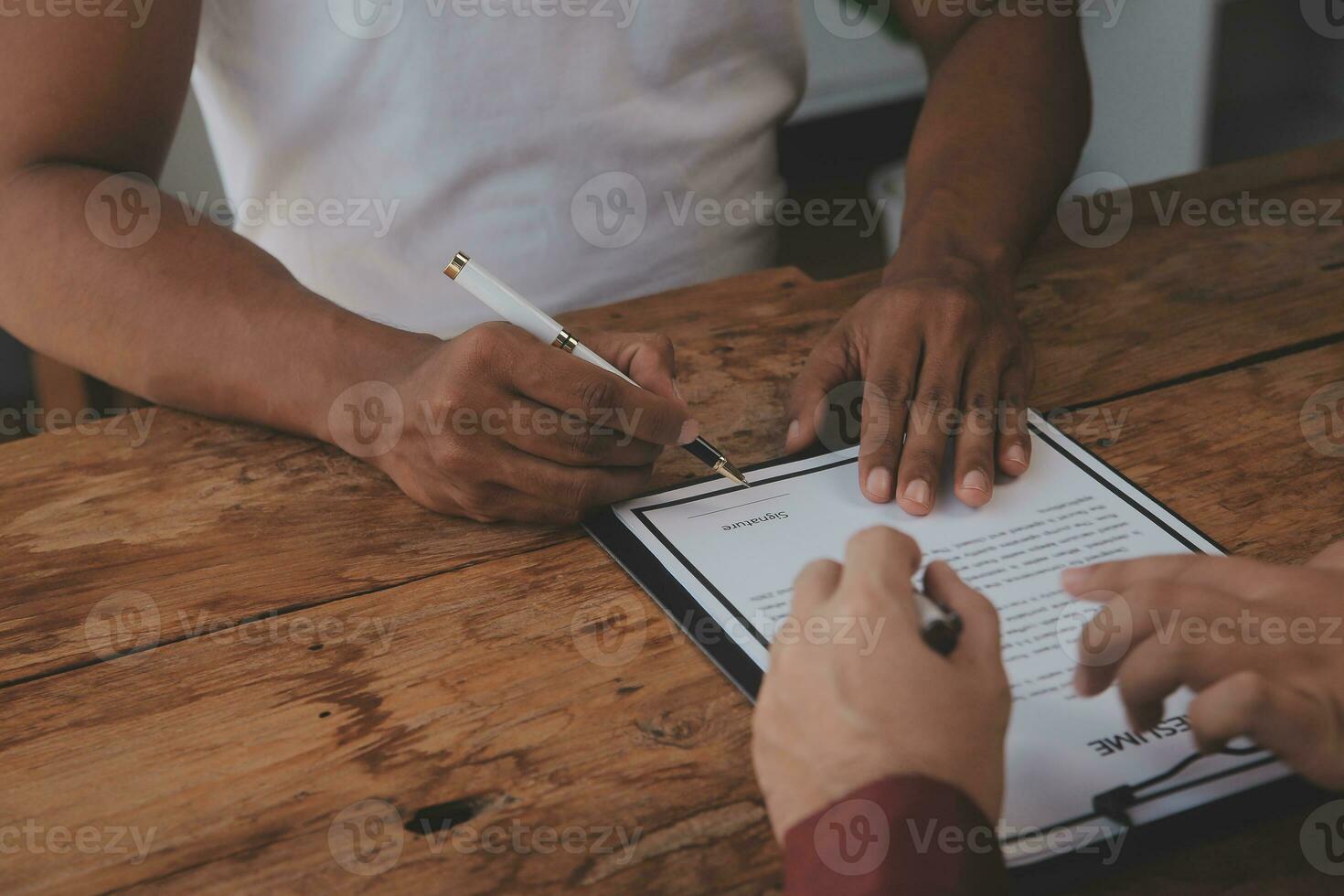 Close up view of job interview in office, focus on resume writing tips, employer reviewing good cv of prepared skilled applicant, recruiter considering application, hr manager making hiring decision photo