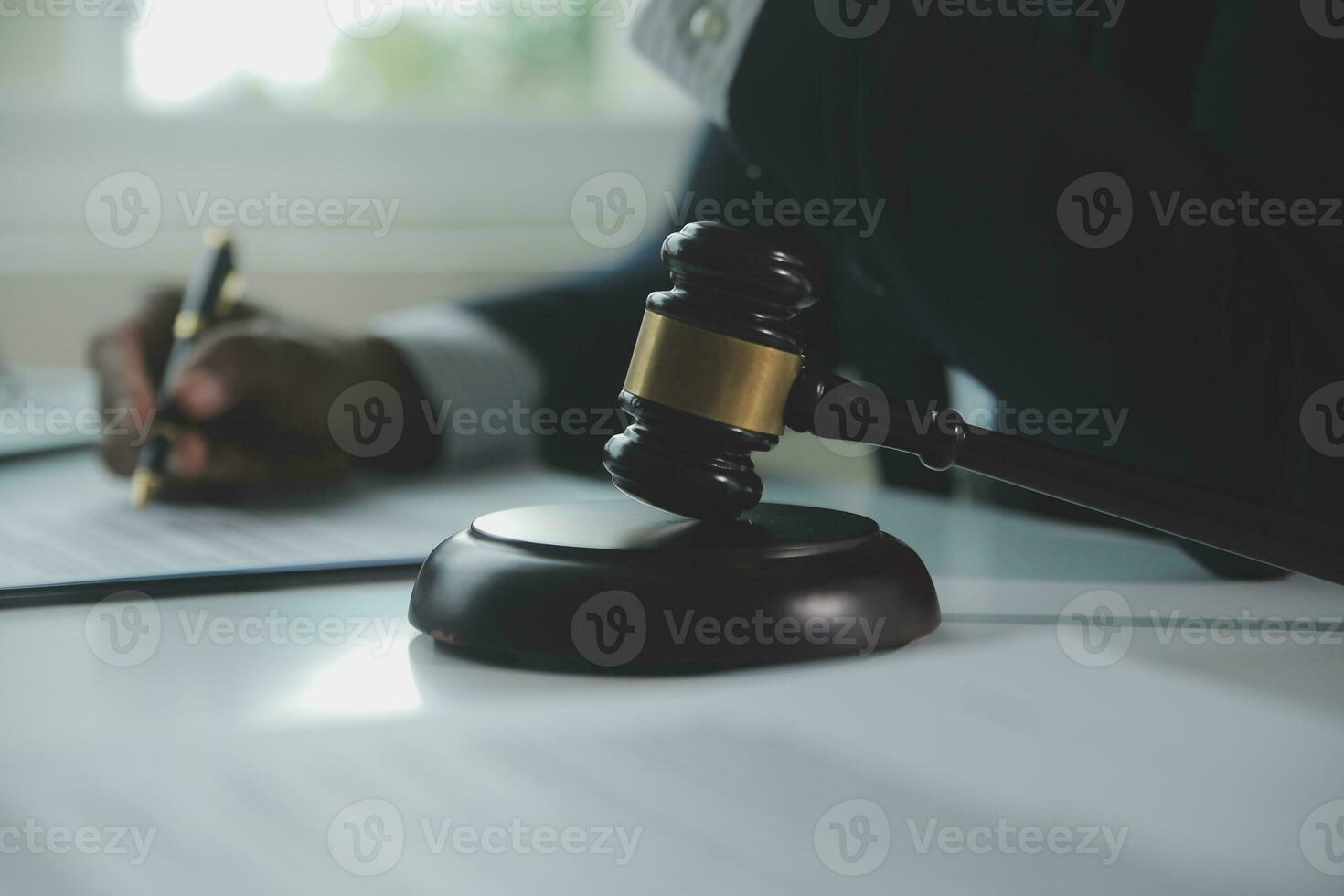 Business and lawyers discussing contract papers with brass scale on desk in office. Law, legal services, advice, justice and law concept picture with film grain effect photo