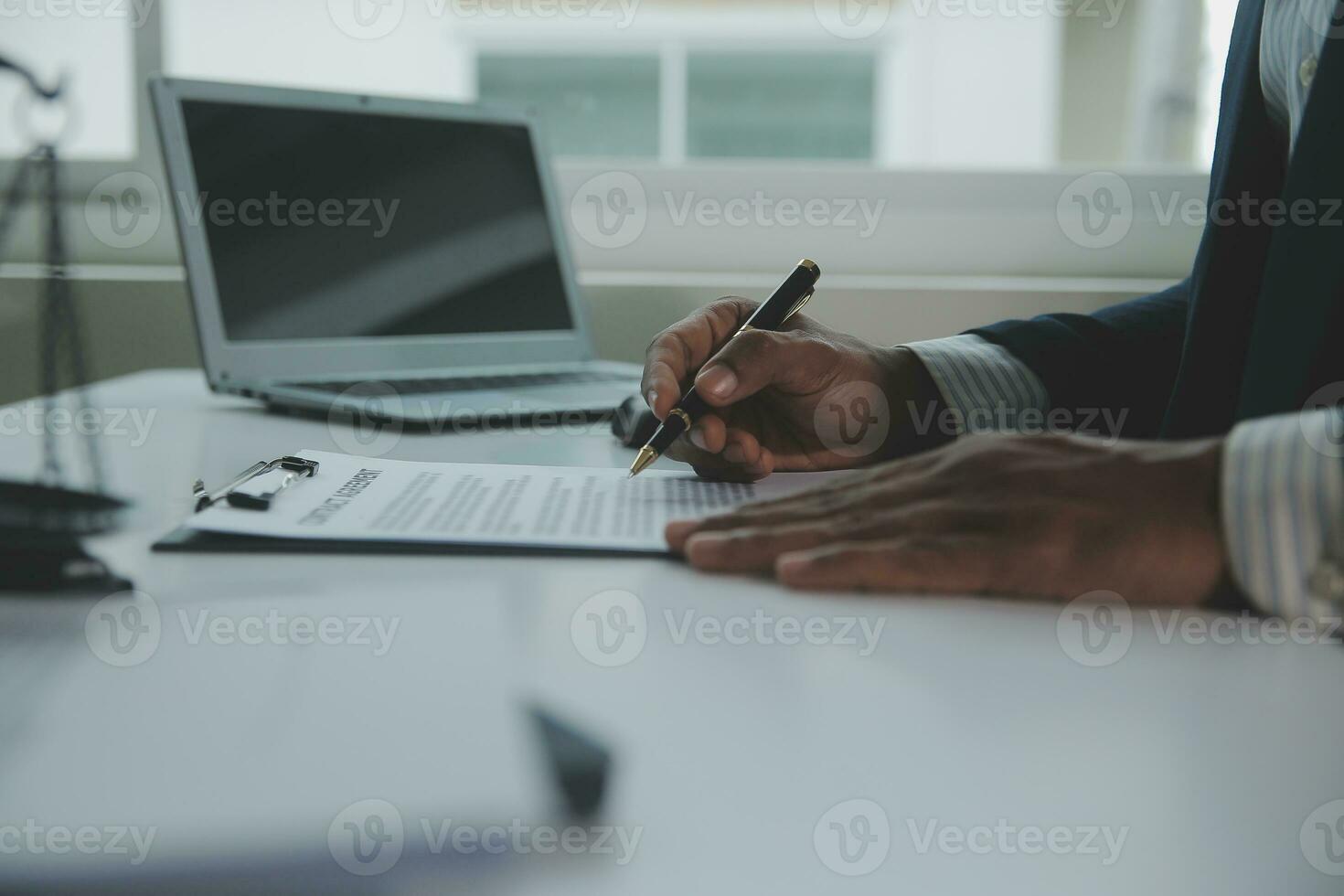 Business and lawyers discussing contract papers with brass scale on desk in office. Law, legal services, advice, justice and law concept picture with film grain effect photo
