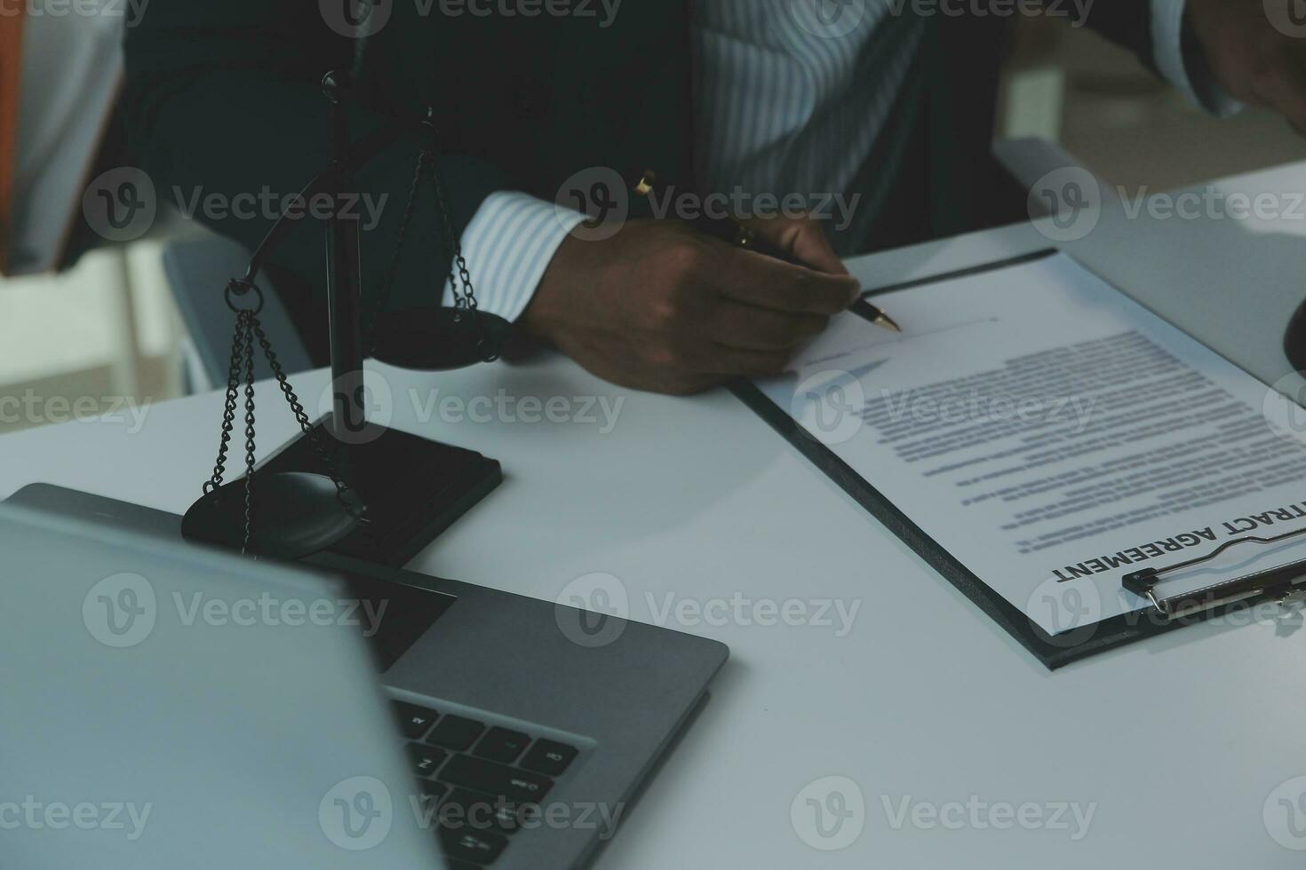 Business and lawyers discussing contract papers with brass scale on desk in office. Law, legal services, advice, justice and law concept picture with film grain effect photo