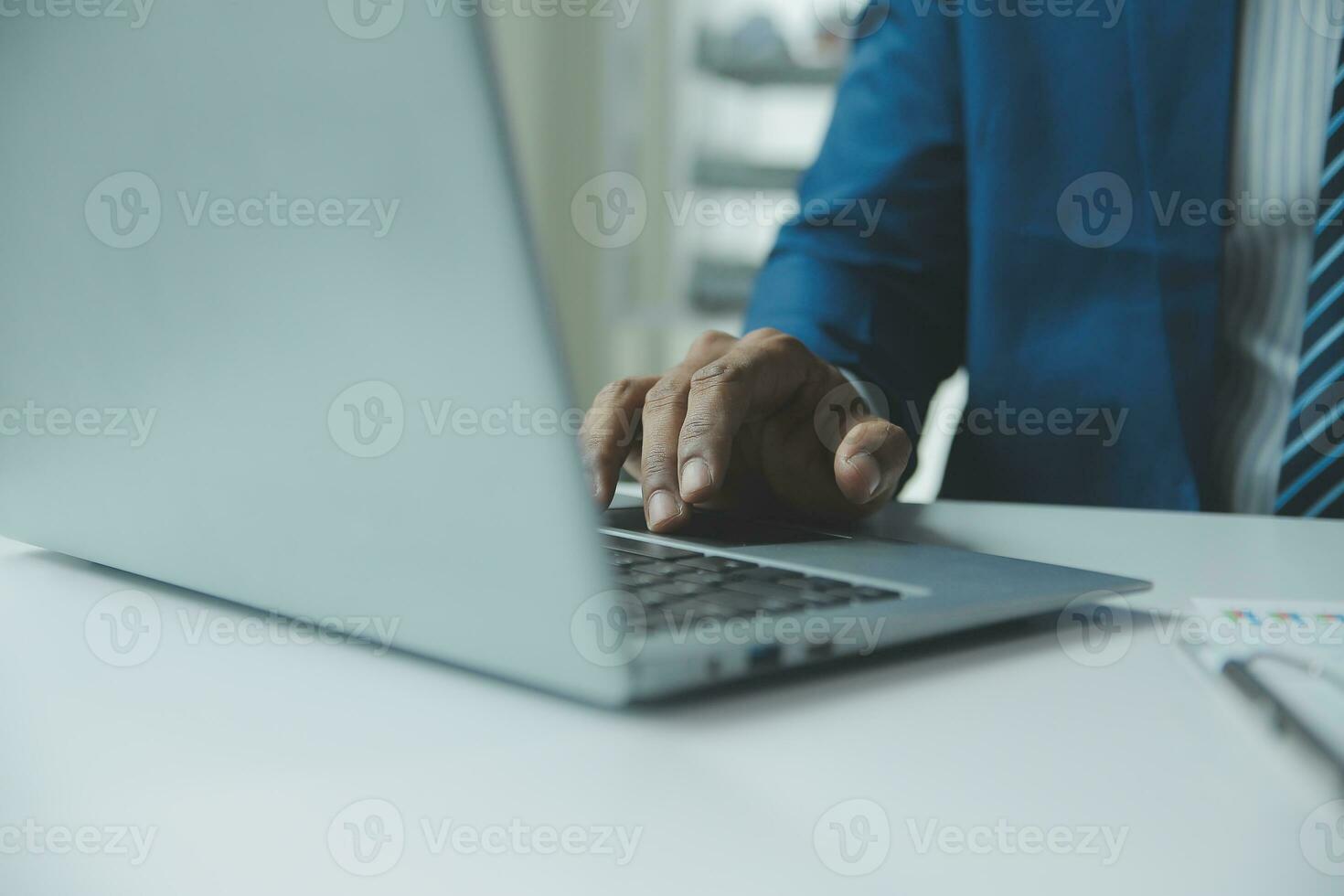 Close up Business woman using calculator and laptop for do math finance on wooden desk, tax, accounting, statistics and analytical research concept photo