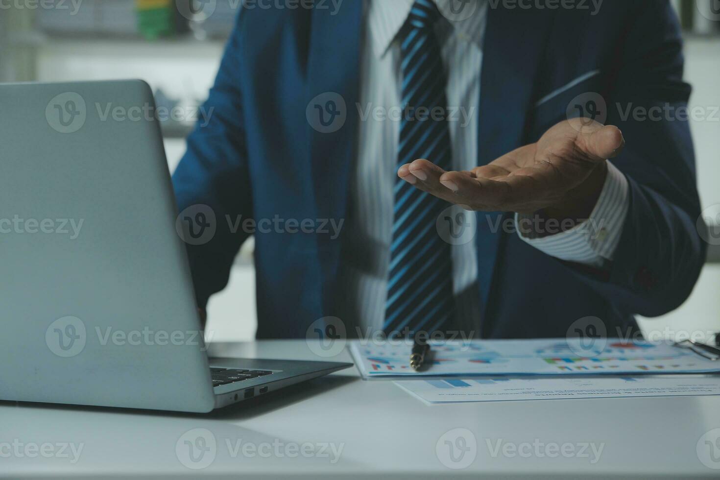 Close up Business woman using calculator and laptop for do math finance on wooden desk, tax, accounting, statistics and analytical research concept photo
