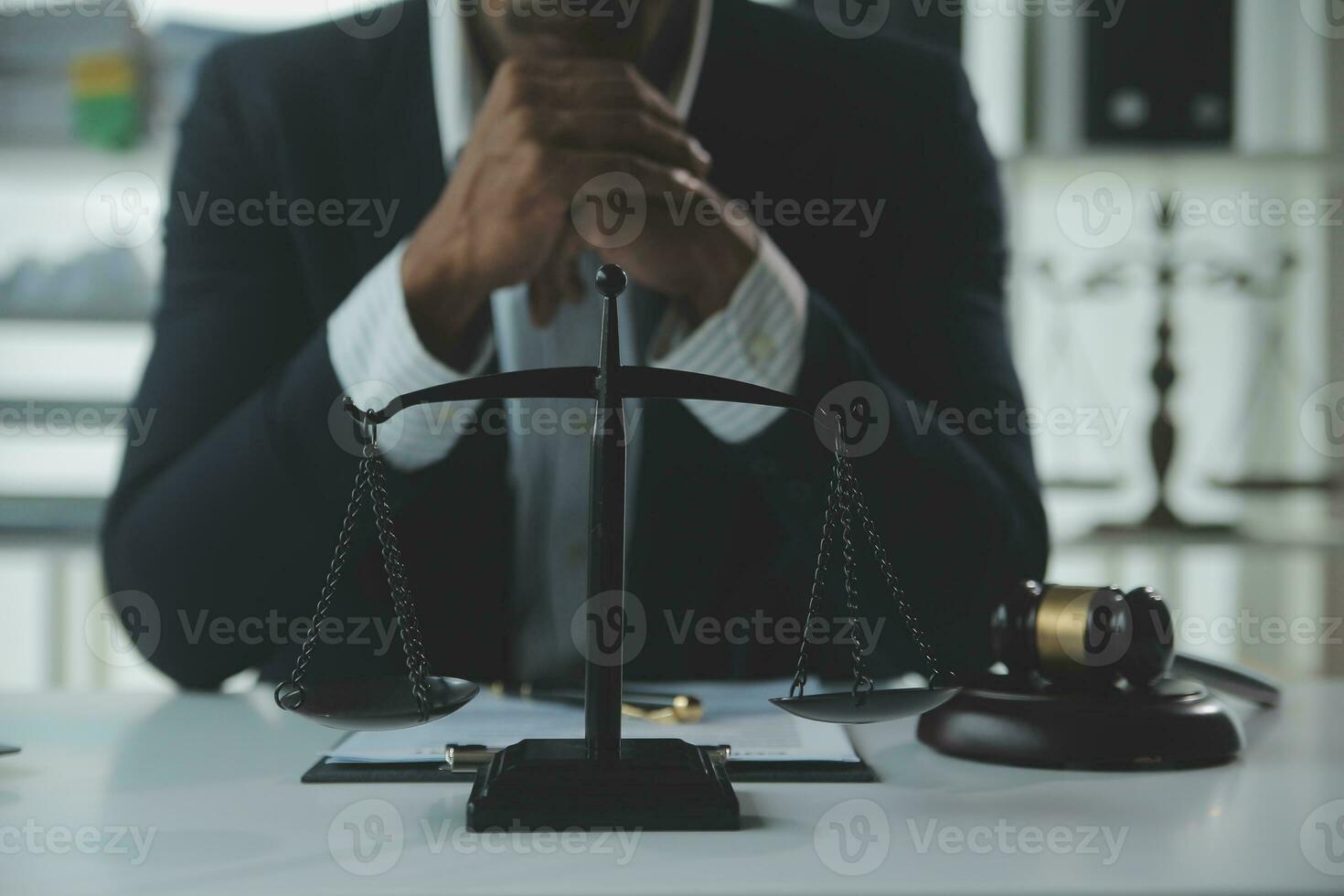 Business and lawyers discussing contract papers with brass scale on desk in office. Law, legal services, advice, justice and law concept picture with film grain effect photo