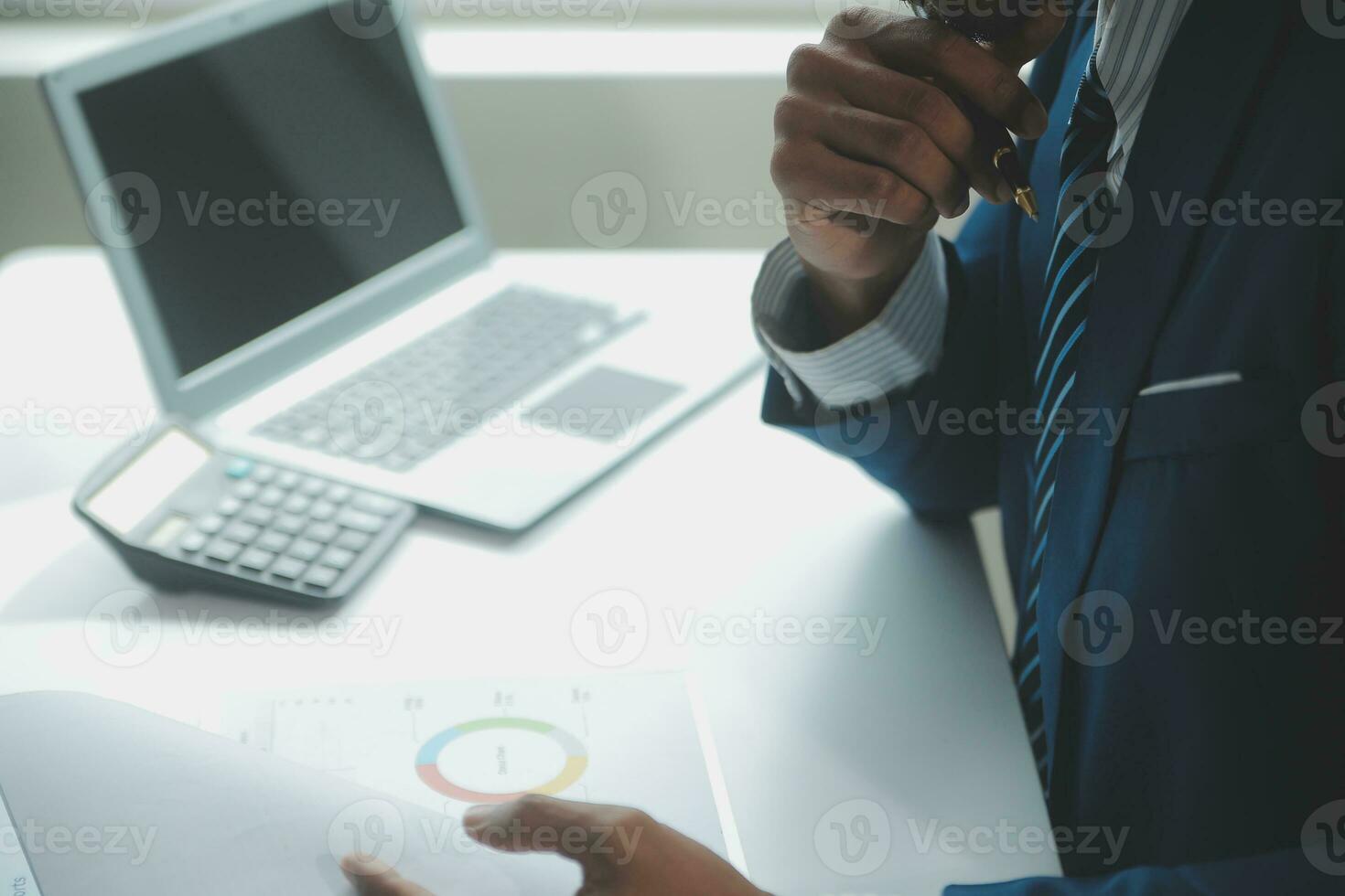 Close up Business woman using calculator and laptop for do math finance on wooden desk, tax, accounting, statistics and analytical research concept photo
