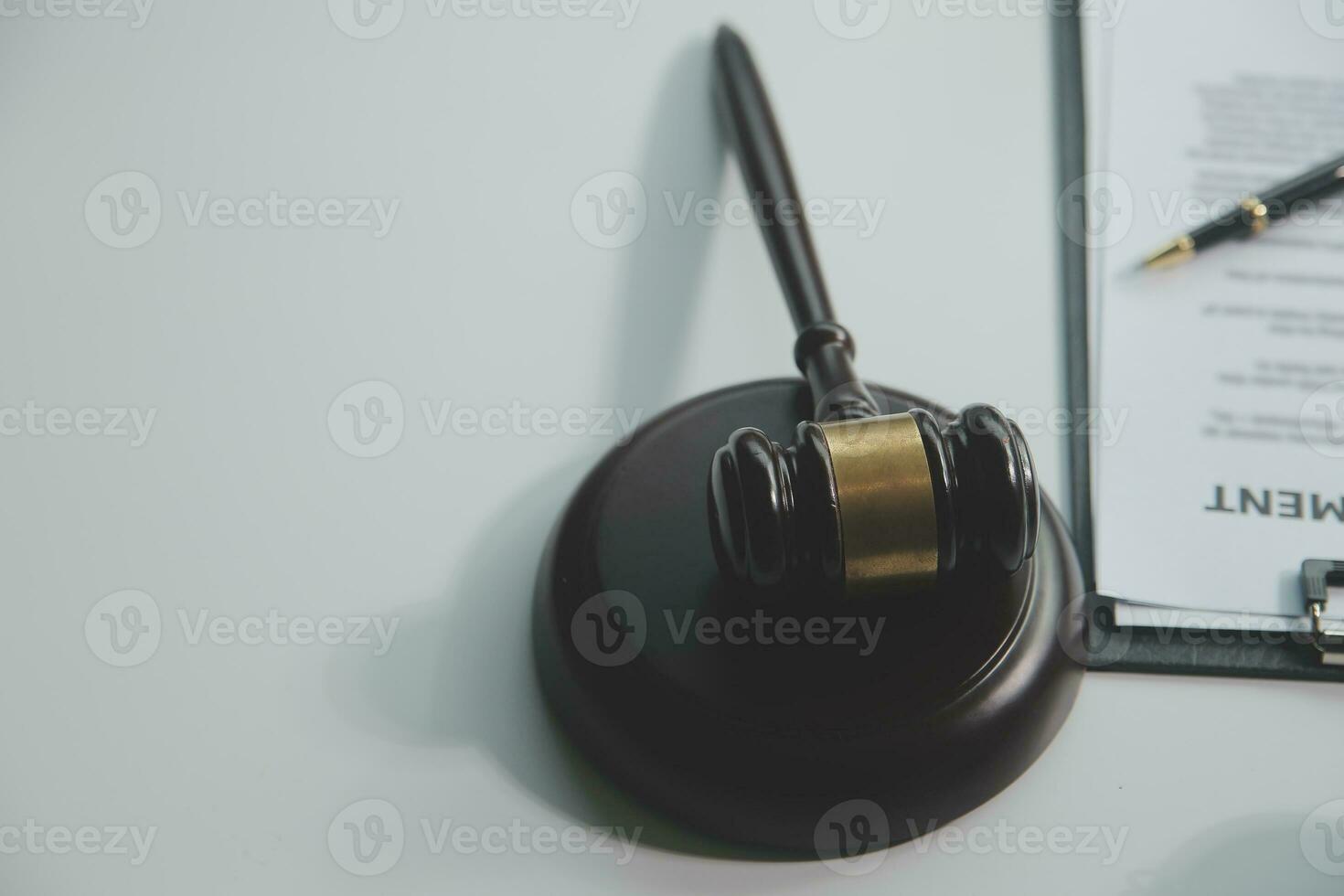Business and lawyers discussing contract papers with brass scale on desk in office. Law, legal services, advice, justice and law concept picture with film grain effect photo