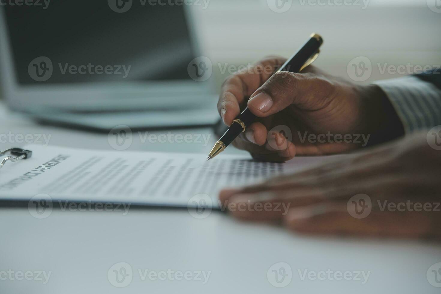 Business and lawyers discussing contract papers with brass scale on desk in office. Law, legal services, advice, justice and law concept picture with film grain effect photo