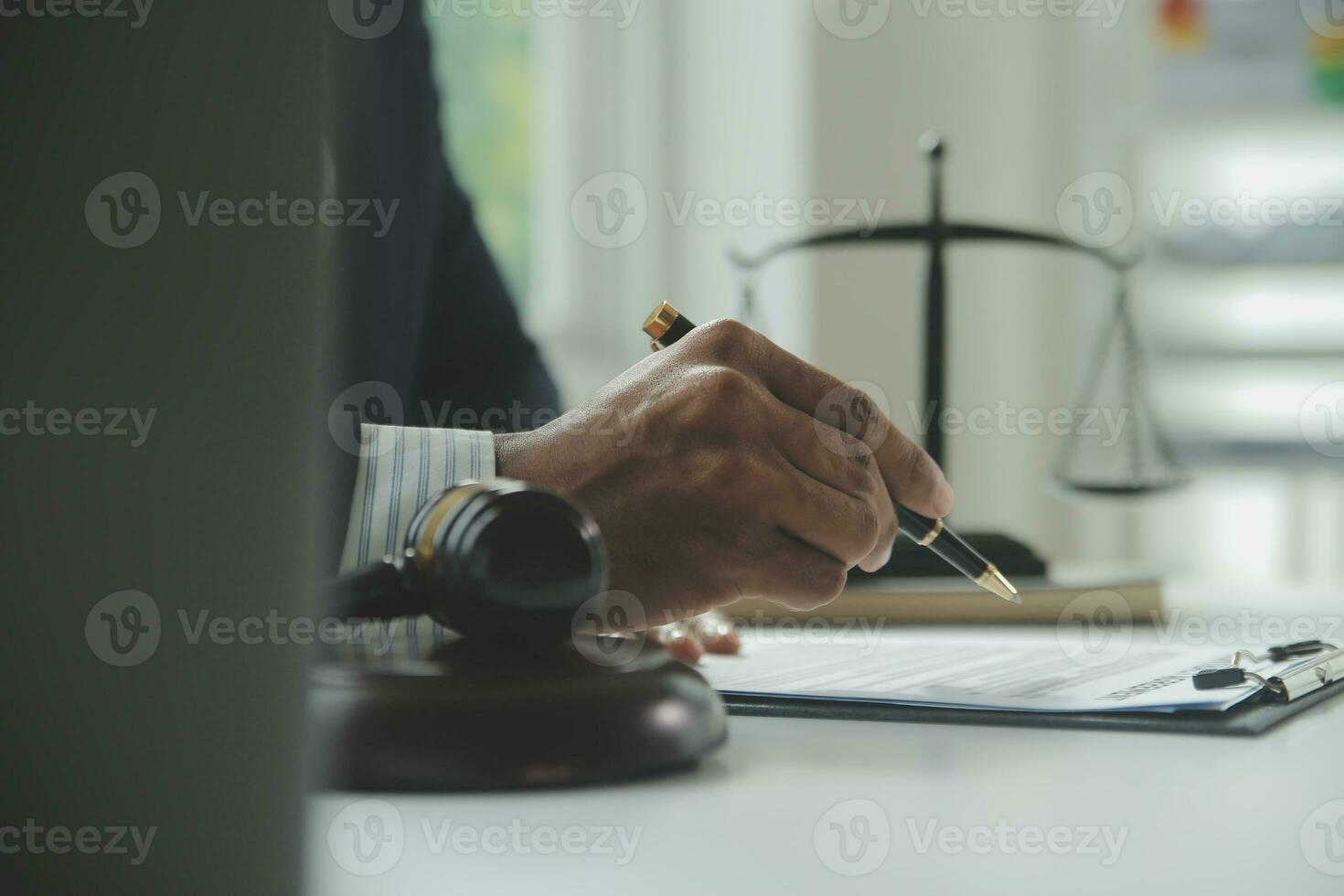 Business and lawyers discussing contract papers with brass scale on desk in office. Law, legal services, advice, justice and law concept picture with film grain effect photo