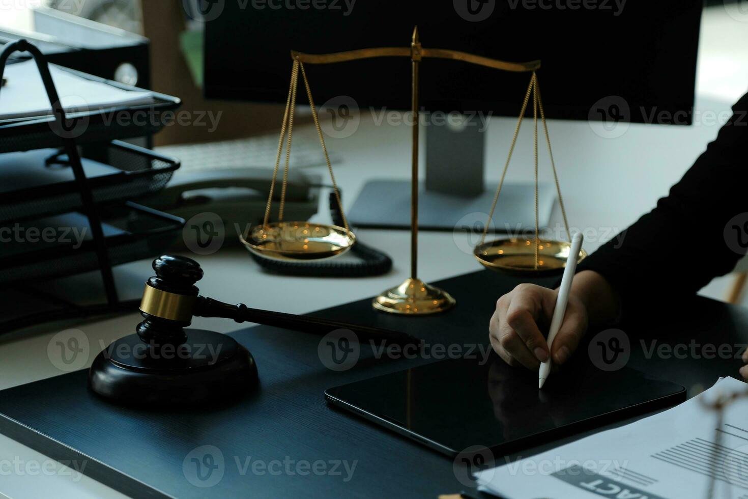 Judge gavel with Justice lawyers having team meeting at law firm in background. Concepts of law. photo