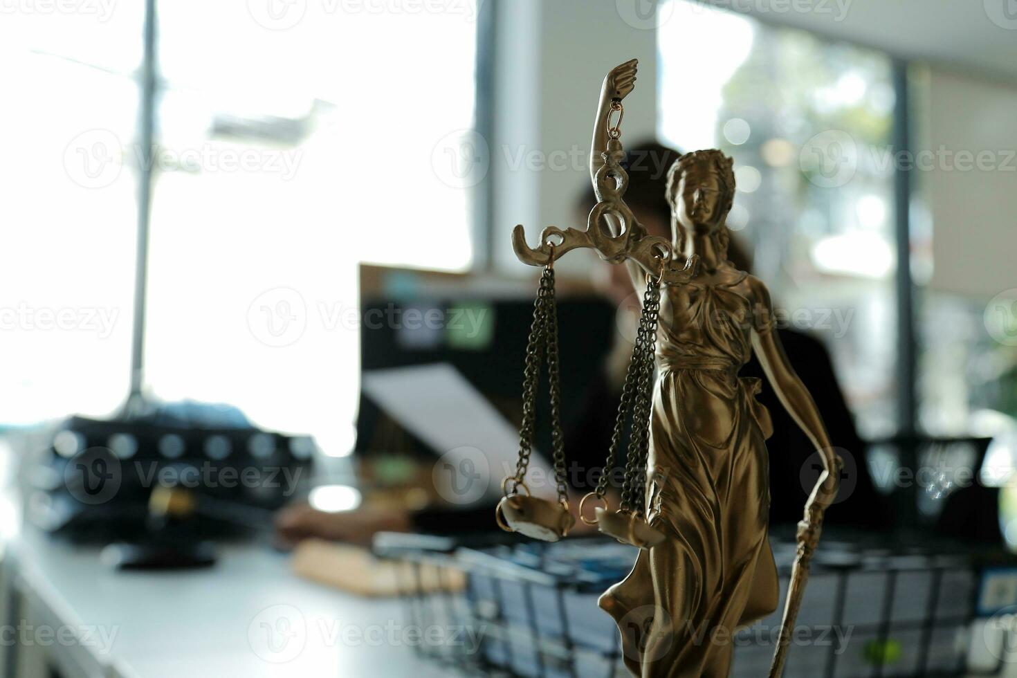Judge gavel with Justice lawyers having team meeting at law firm in background. Concepts of law. photo