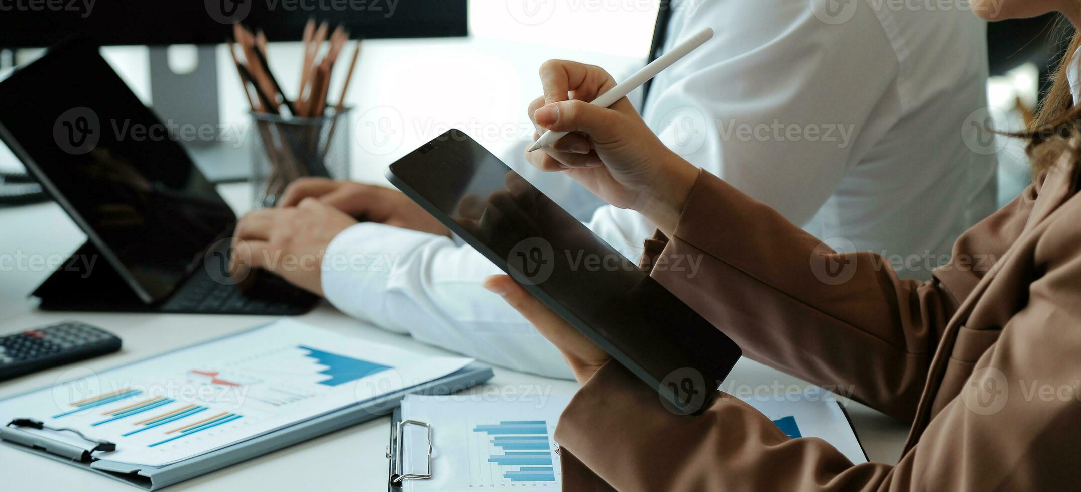 Team of business people working together in the meeting room office, teamwork background charts and graphs banner, double exposure successful teamwork,business planning concept. photo
