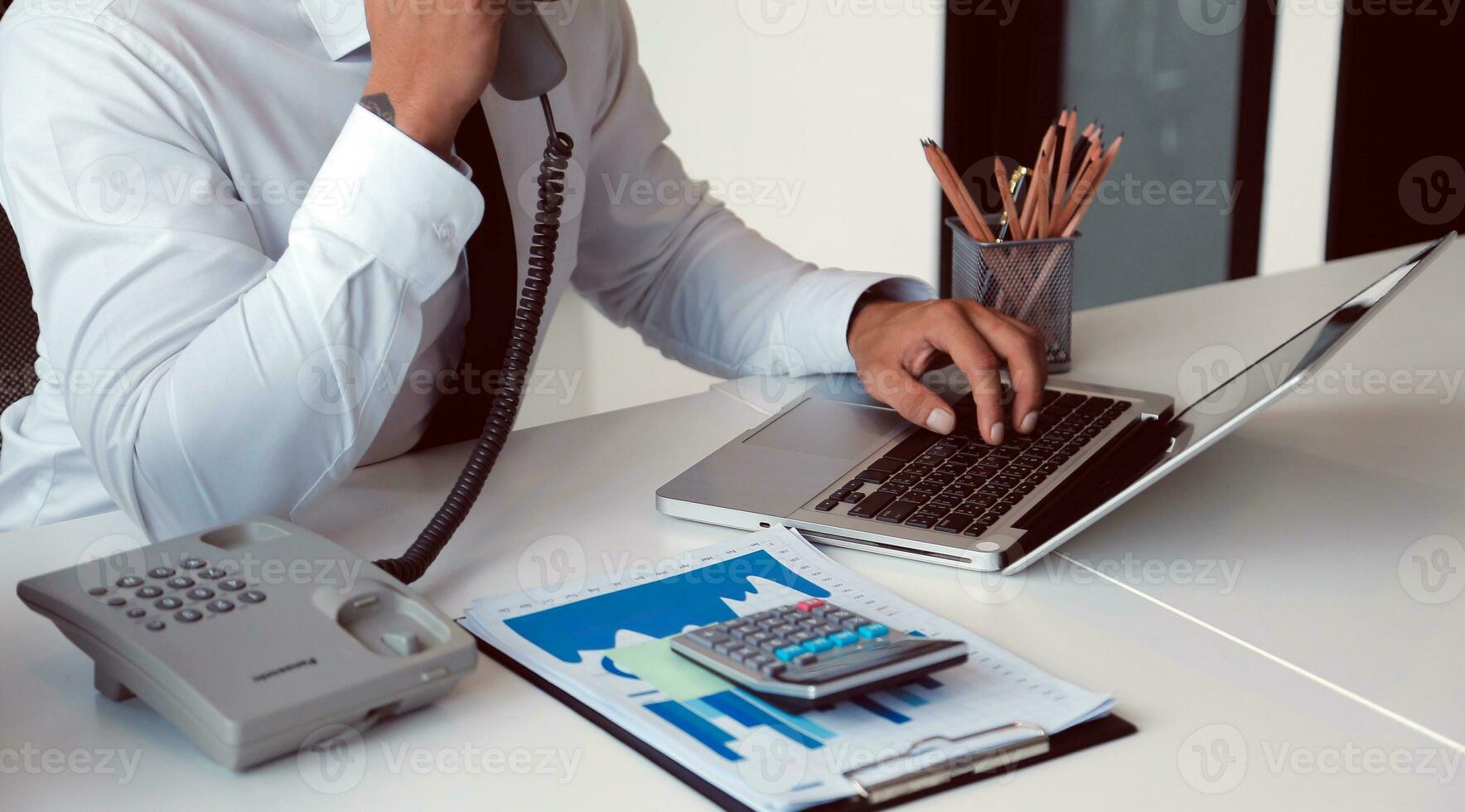 Close up of Business team analyzing income charts and graphs with modern laptop computer. Business analysis and strategy concept. photo
