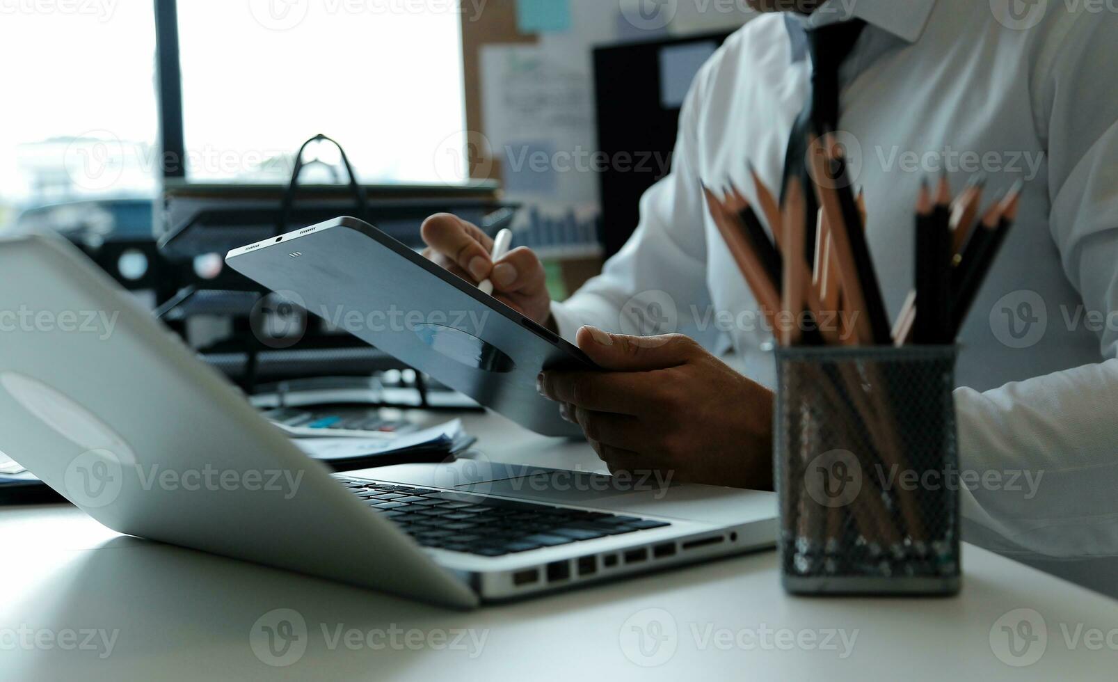 Close up of Business team analyzing income charts and graphs with modern laptop computer. Business analysis and strategy concept. photo